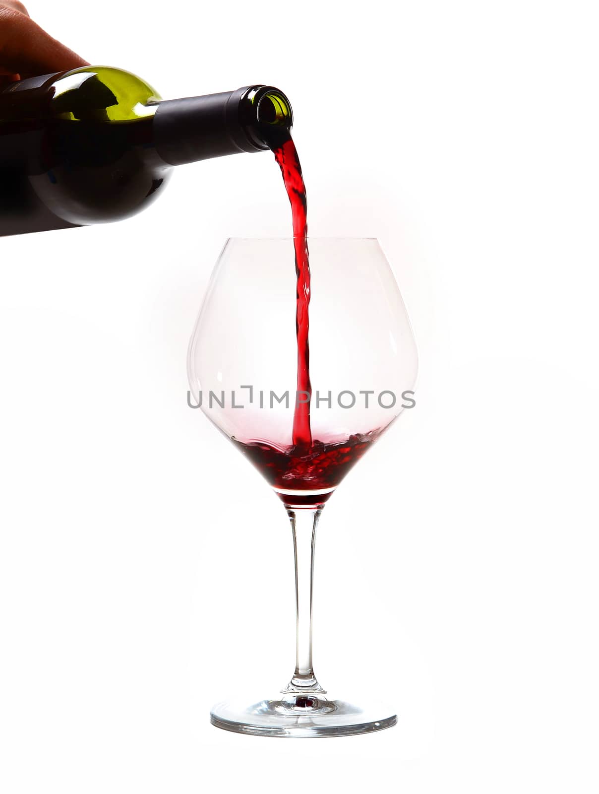 Man Hand holding Bottle filling Glass with Red Wine isolated on white background 