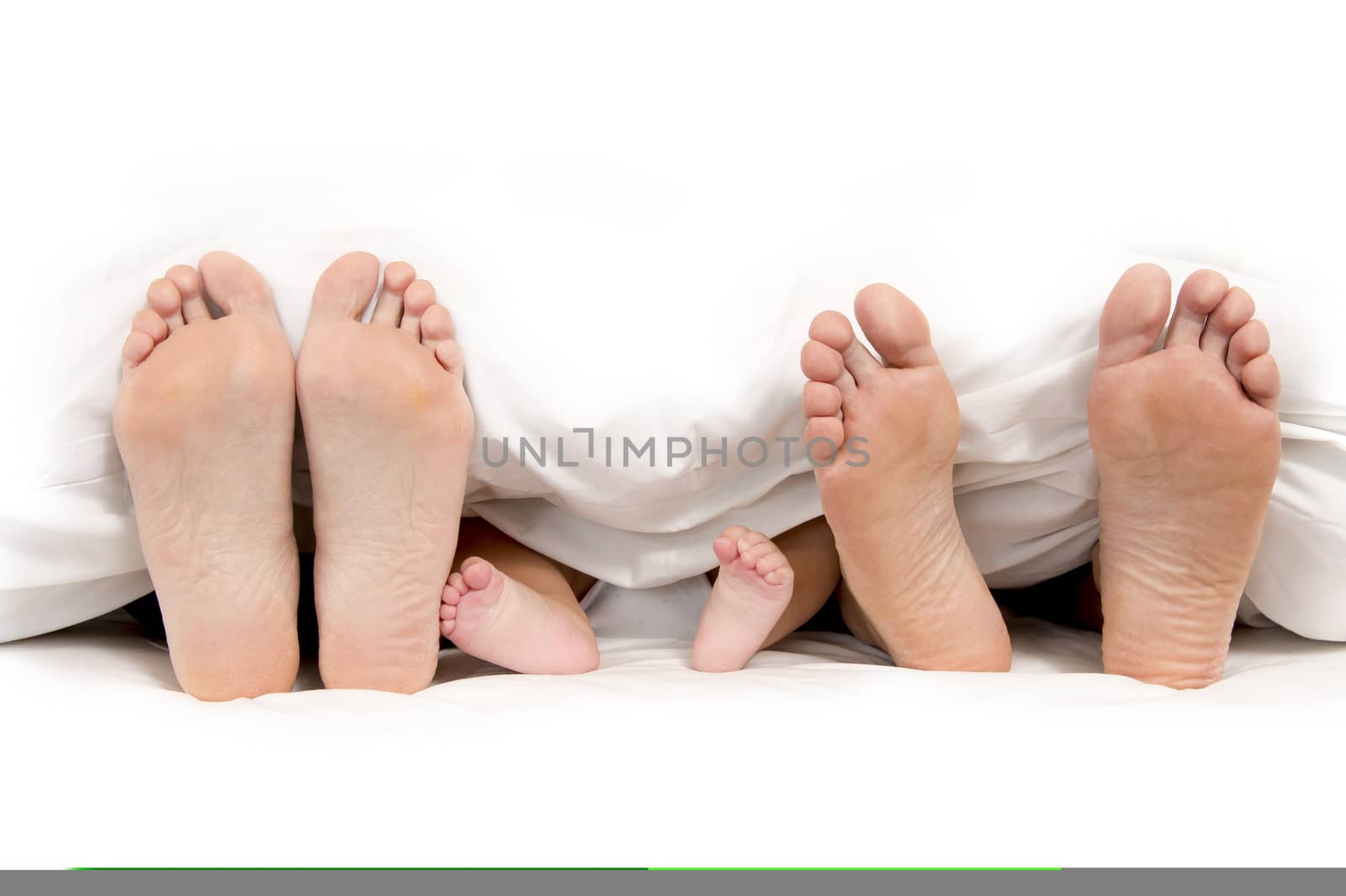 Mother Father and Baby Feet under Blanket by ocusfocus