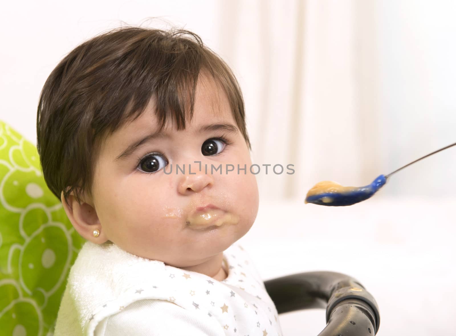 hand with spoon  Feeding cute Lovely Baby Girl 