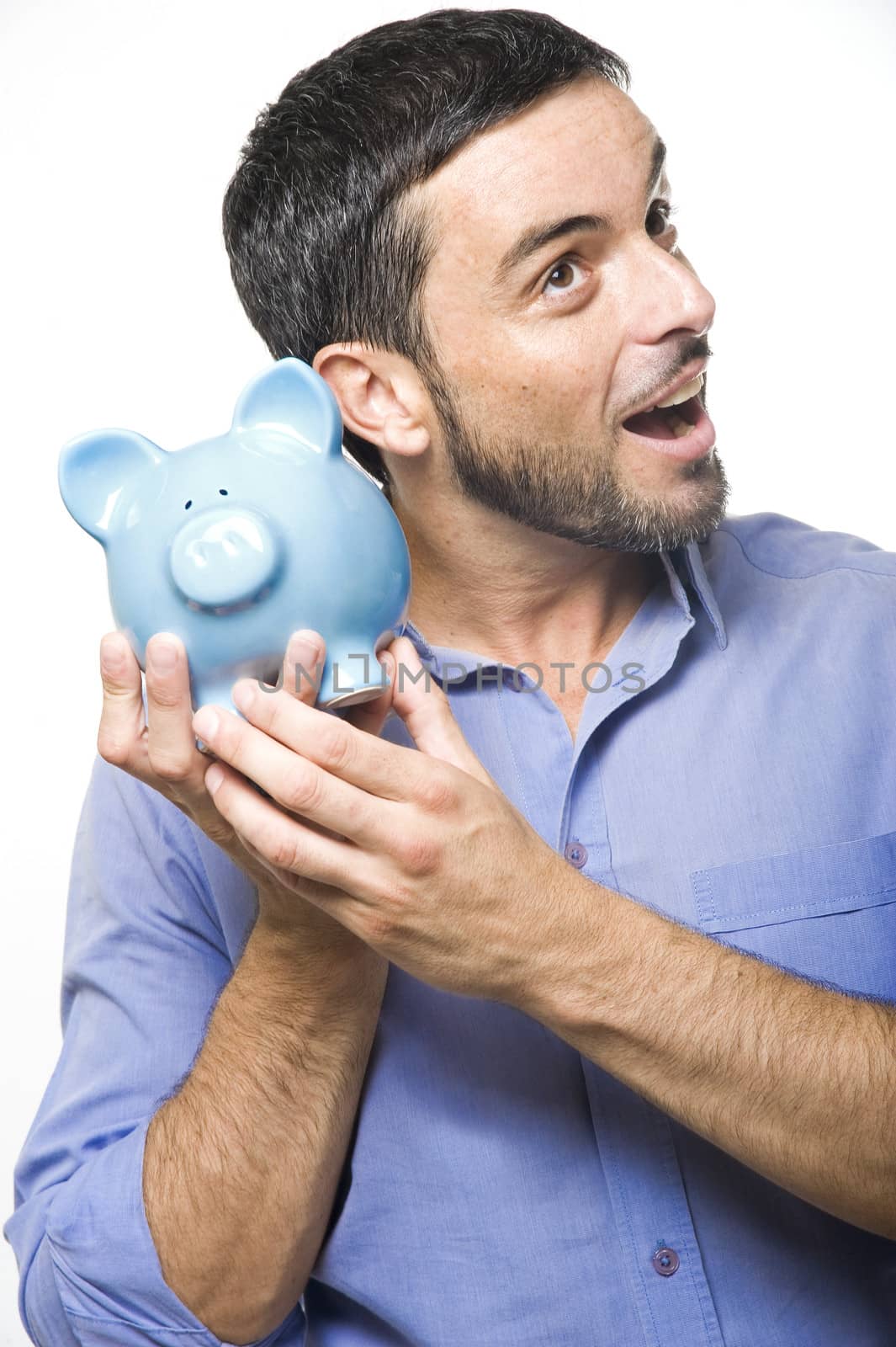 Handsome Young Man with Beard shaking Blue Piggy bank Isolated on White Background