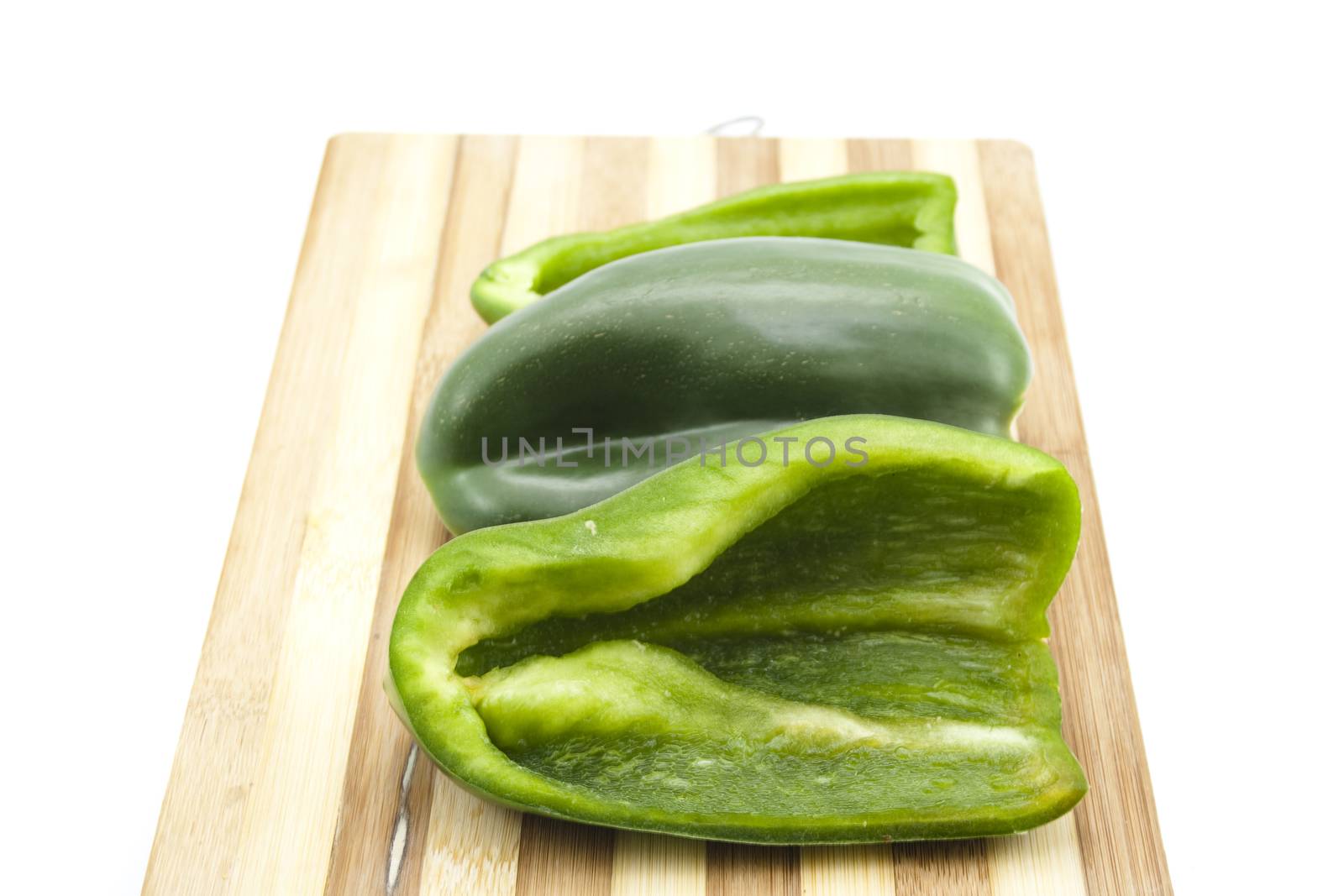 Fresh Green Capsicum on Edge Board