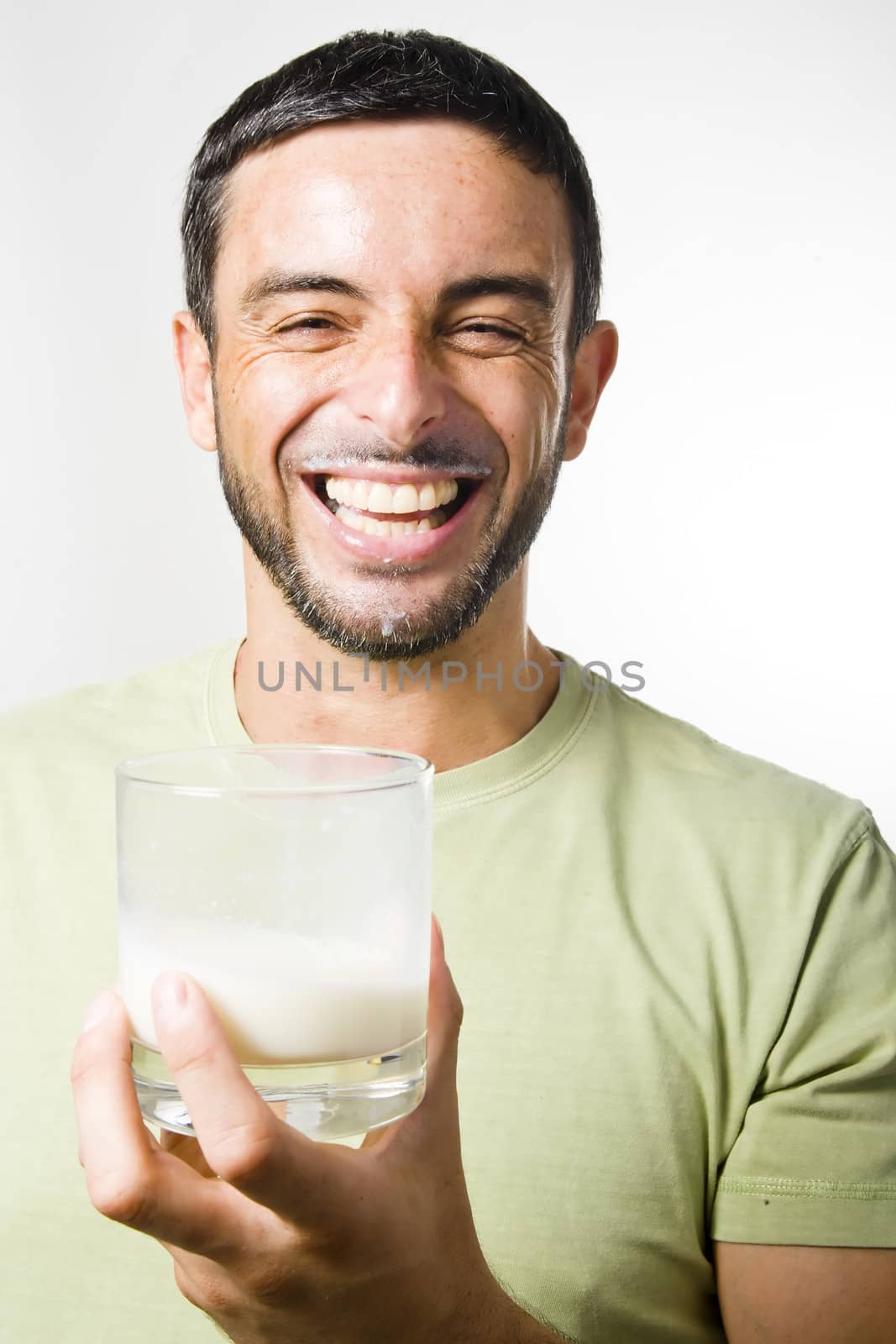 Healthy Young Handsome Man with Beard drinking Milk isolated on White Background