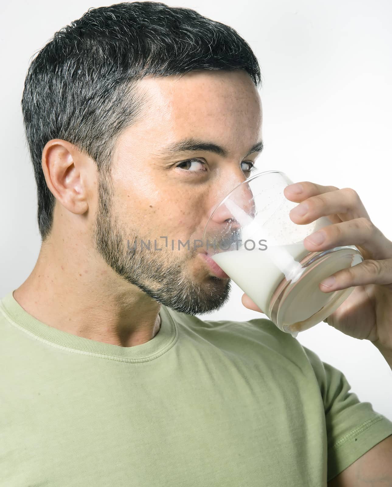 Healthy Young Handsome Man with Beard drinking Milk isolated on White Background