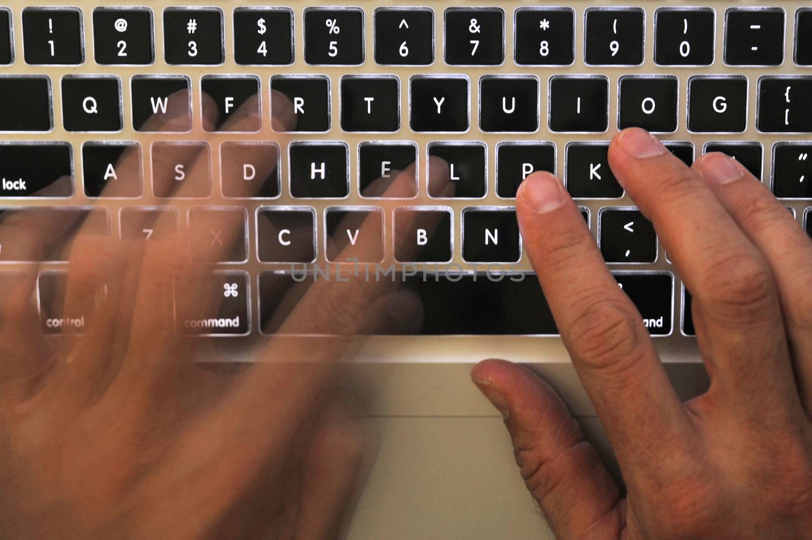 close up of a busy hands working on a laptop keyboard with the words help highlighted on the keyboard
