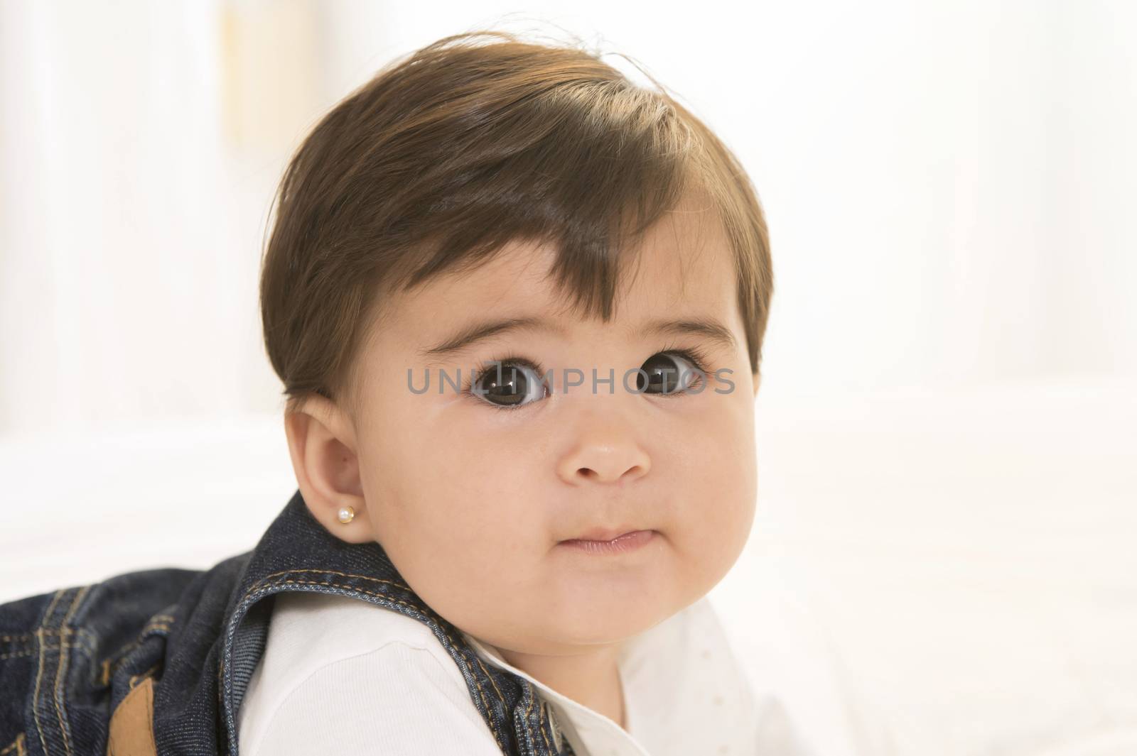 Big eyed Lovely Baby Girl isolated on white background by ocusfocus