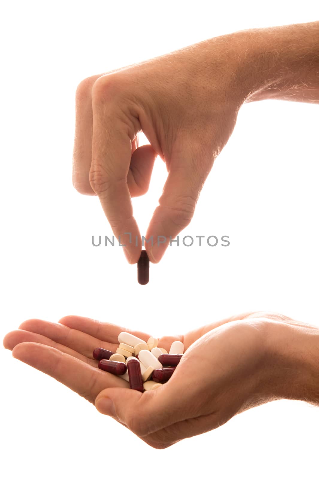 Male Hand Holding Pills by ocusfocus