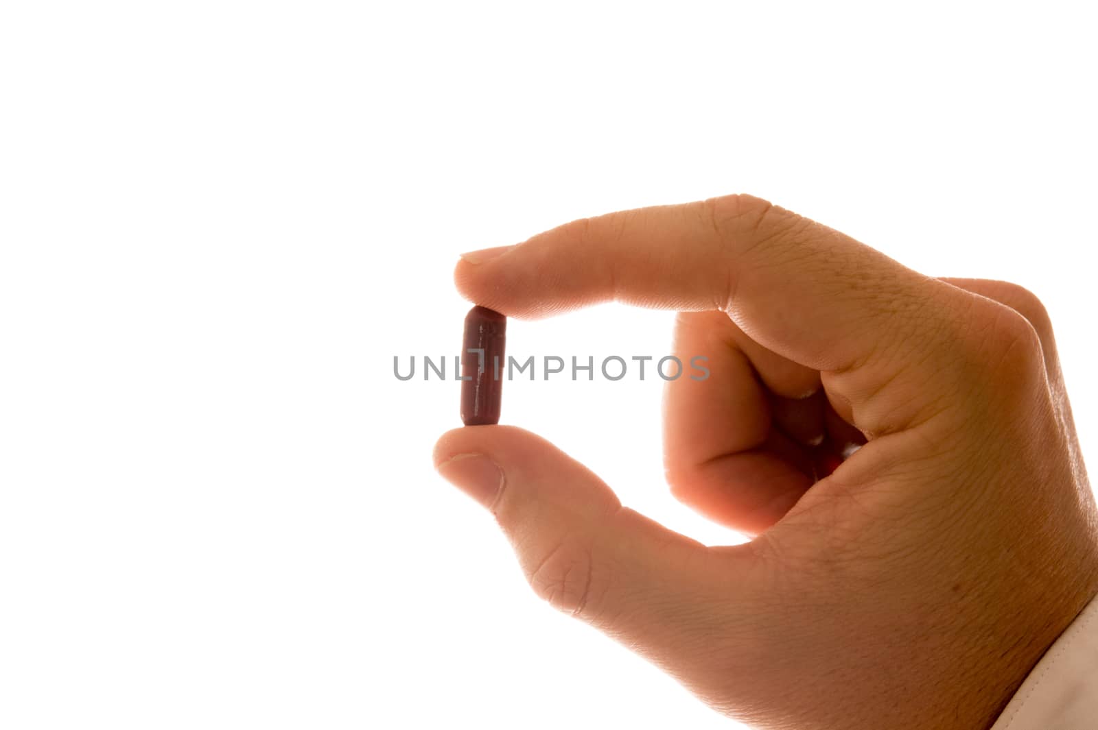 Male Hand with Pill isolated in White