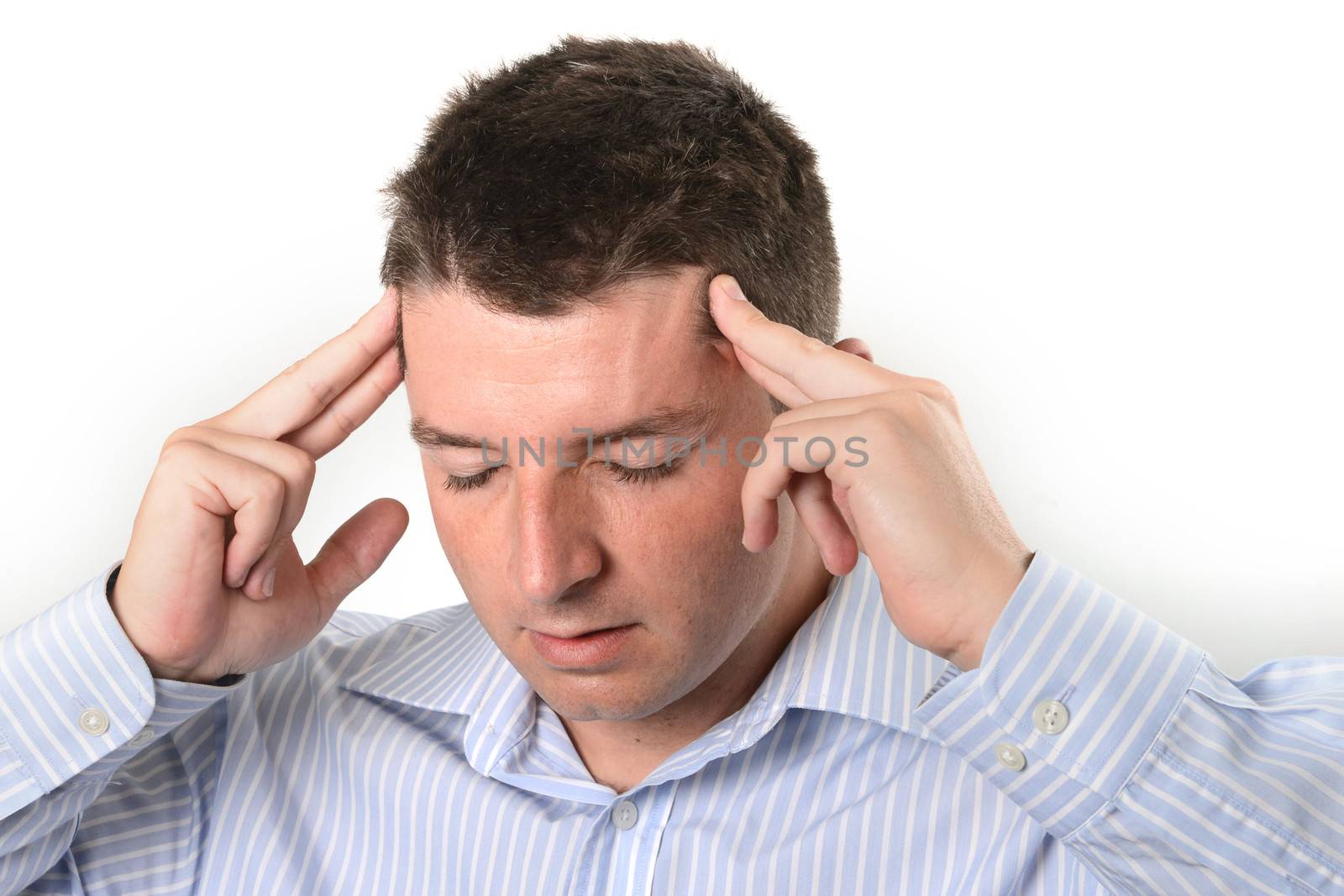 businessman wearing a blue business shirt is over worked and with a headache on a white background