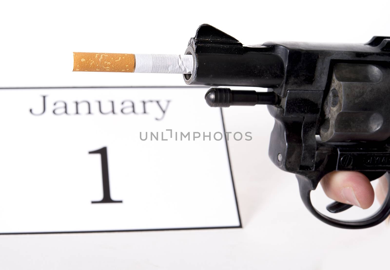 New Years Resolution quit smoking concept with cigarette and gun