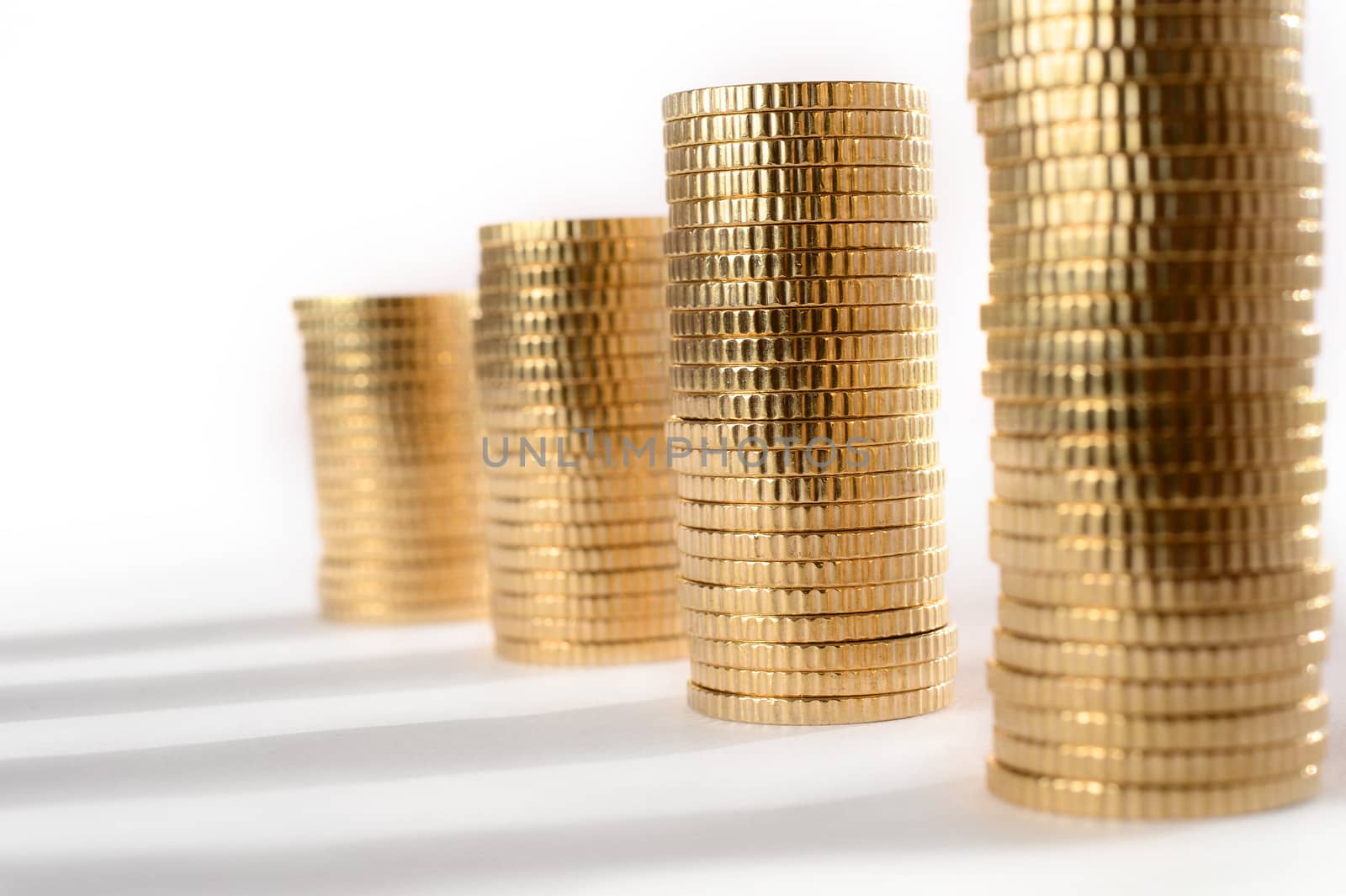 Macro Euro Coins piled in stacks isolated on white background