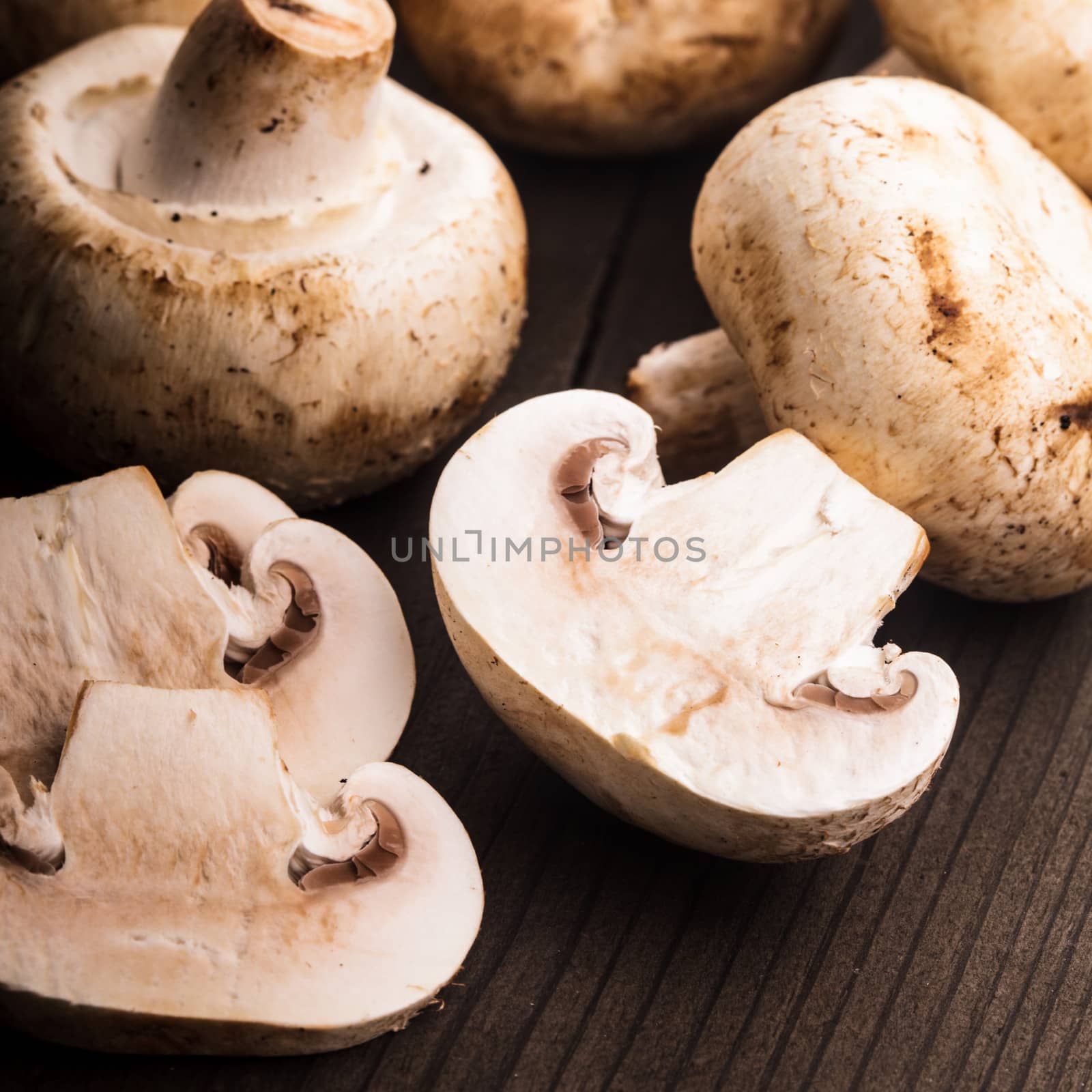 Champignons and slices on the wooden table closeup