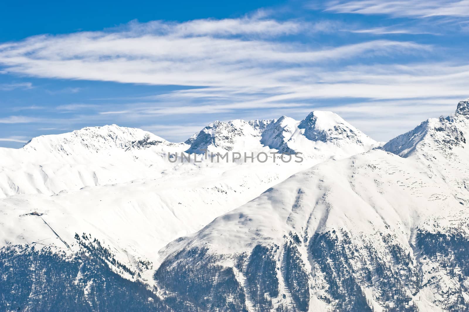  panoramic view of the swiss Alps covered with snow at a sunny winters day in Saint Moritz, Switzerland