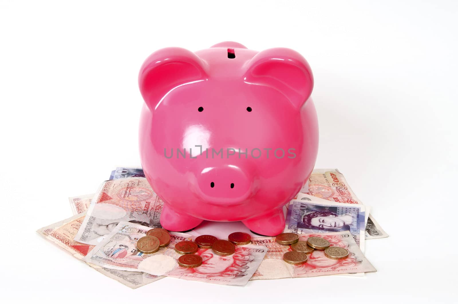 Pink Piggy bank with pound icons and GBP notes next to it