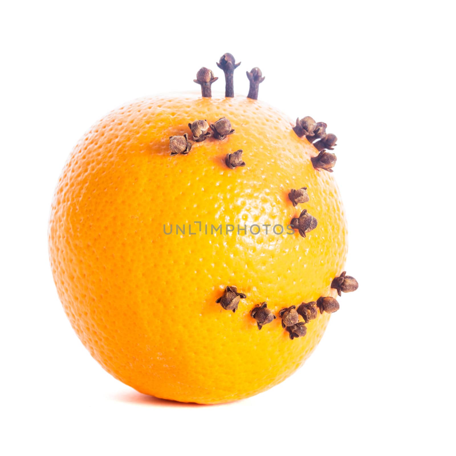 Christmas orange face made from cloves isolated on white