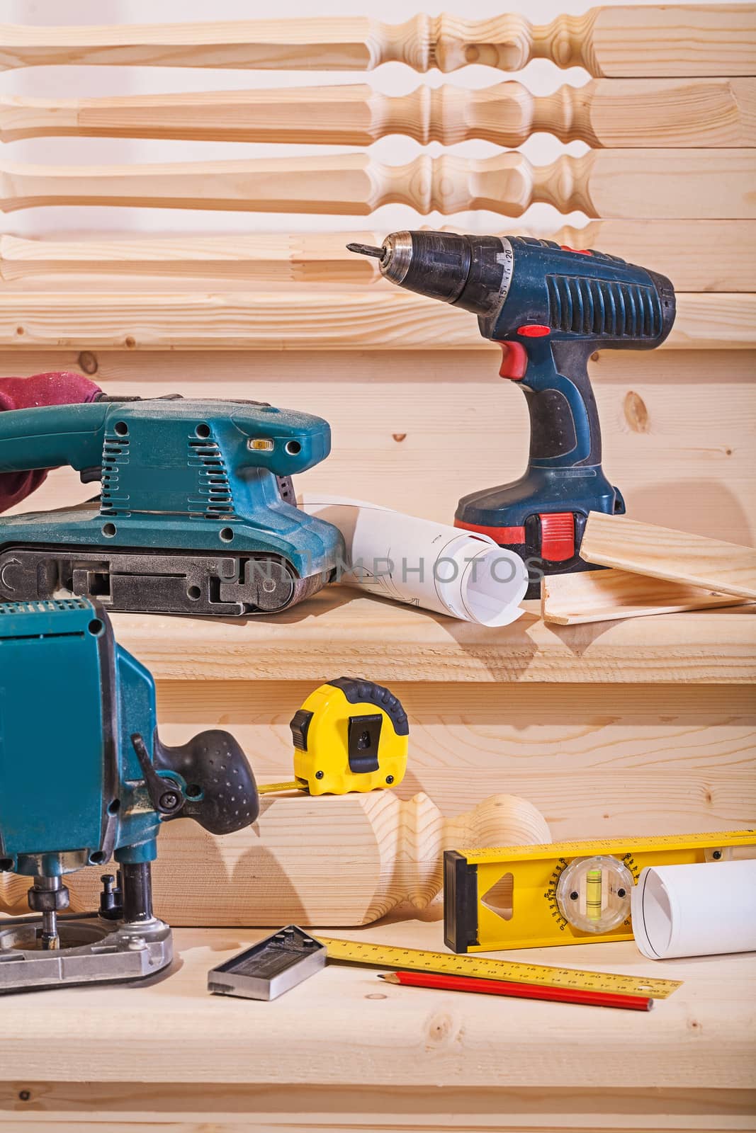 working tools on steps of wooden ladder