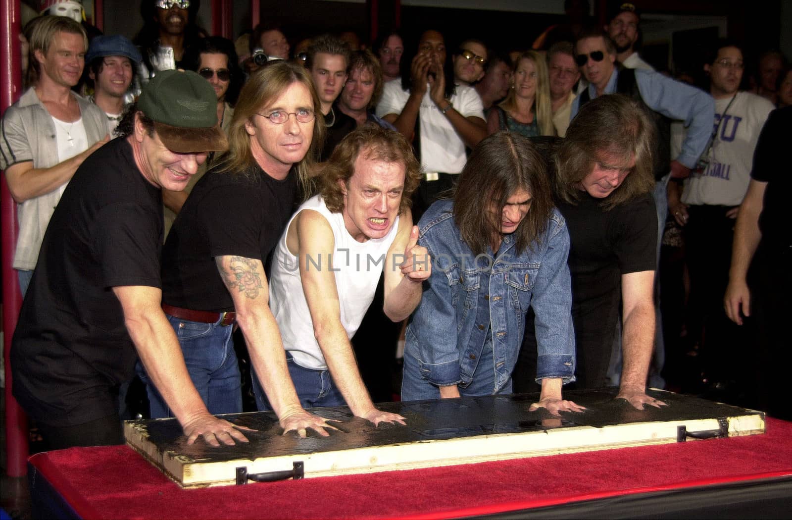 Cliff Williams, Brian Johnson, Angus Young, Malcolm Young at the ceremony where they were inducted into Sunset Blvd's Rockwalk. 09-15-00