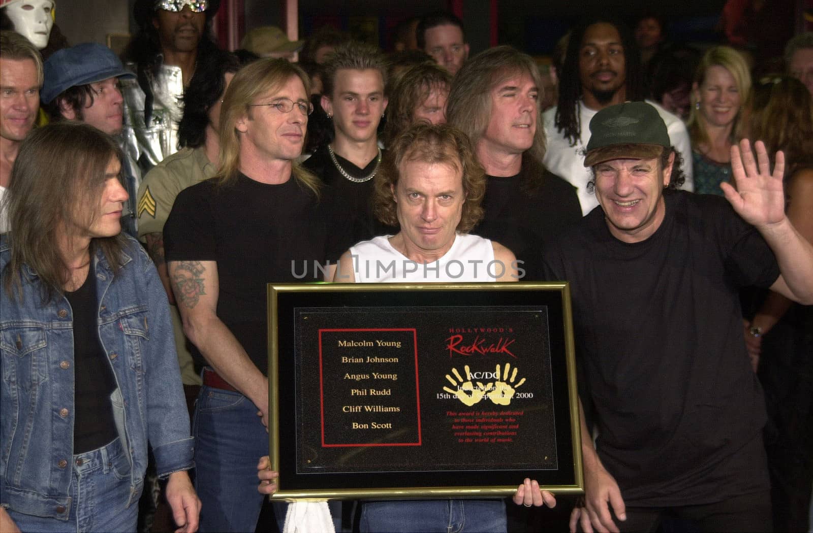 Cliff Williams, Brian Johnson, Angus Young, Malcolm Young at the ceremony where they were inducted into Sunset Blvd's Rockwalk. 09-15-00