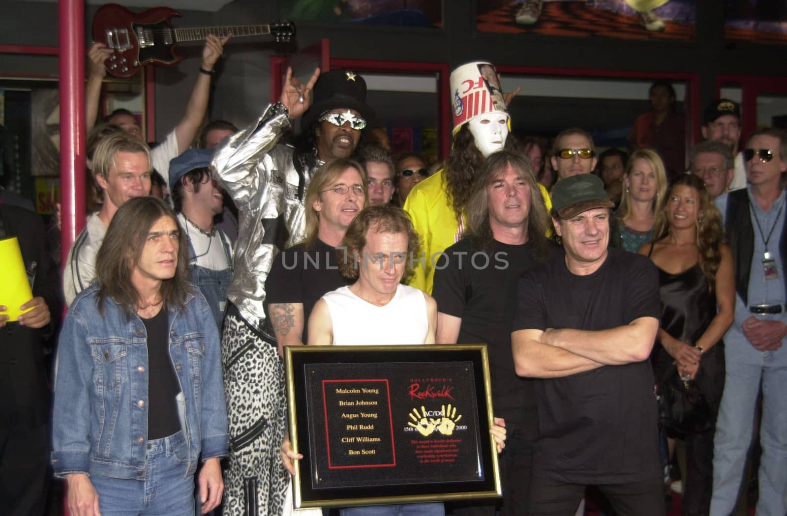 Cliff Williams, Brian Johnson, Angus Young, Malcolm Young at the ceremony where they were inducted into Sunset Blvd's Rockwalk. 09-15-00