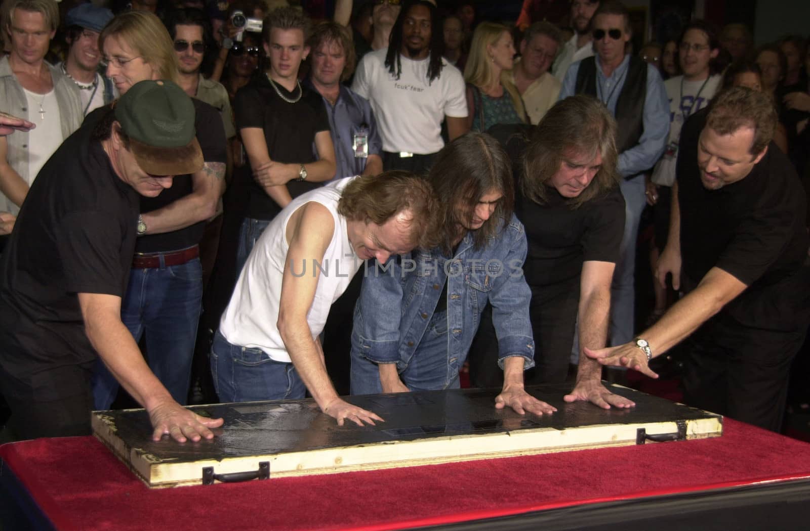 Cliff Williams, Brian Johnson, Angus Young, Malcolm Young at the ceremony where they were inducted into Sunset Blvd's Rockwalk. 09-15-00