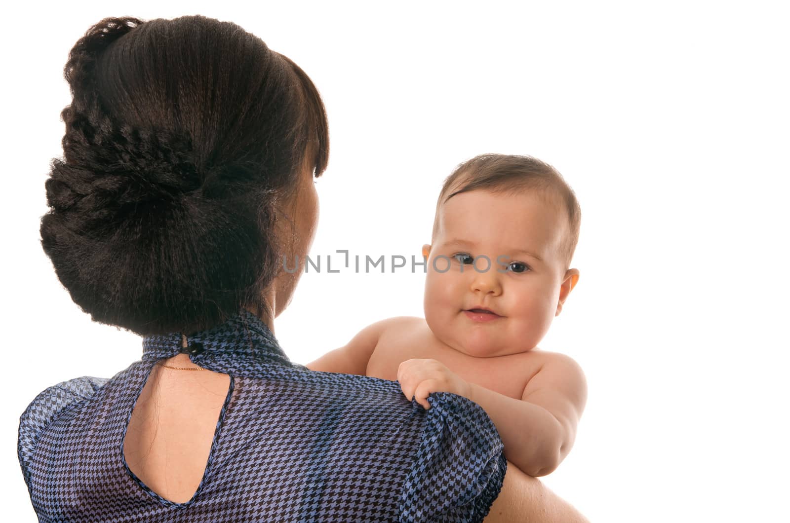 Baby girl watching over mother's shoulder isolated on white