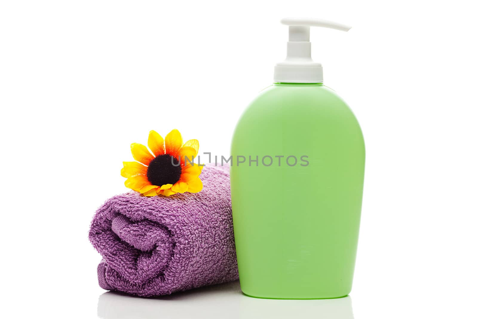 cosmetic containers,towel and sunflower isolated on white by jannyjus