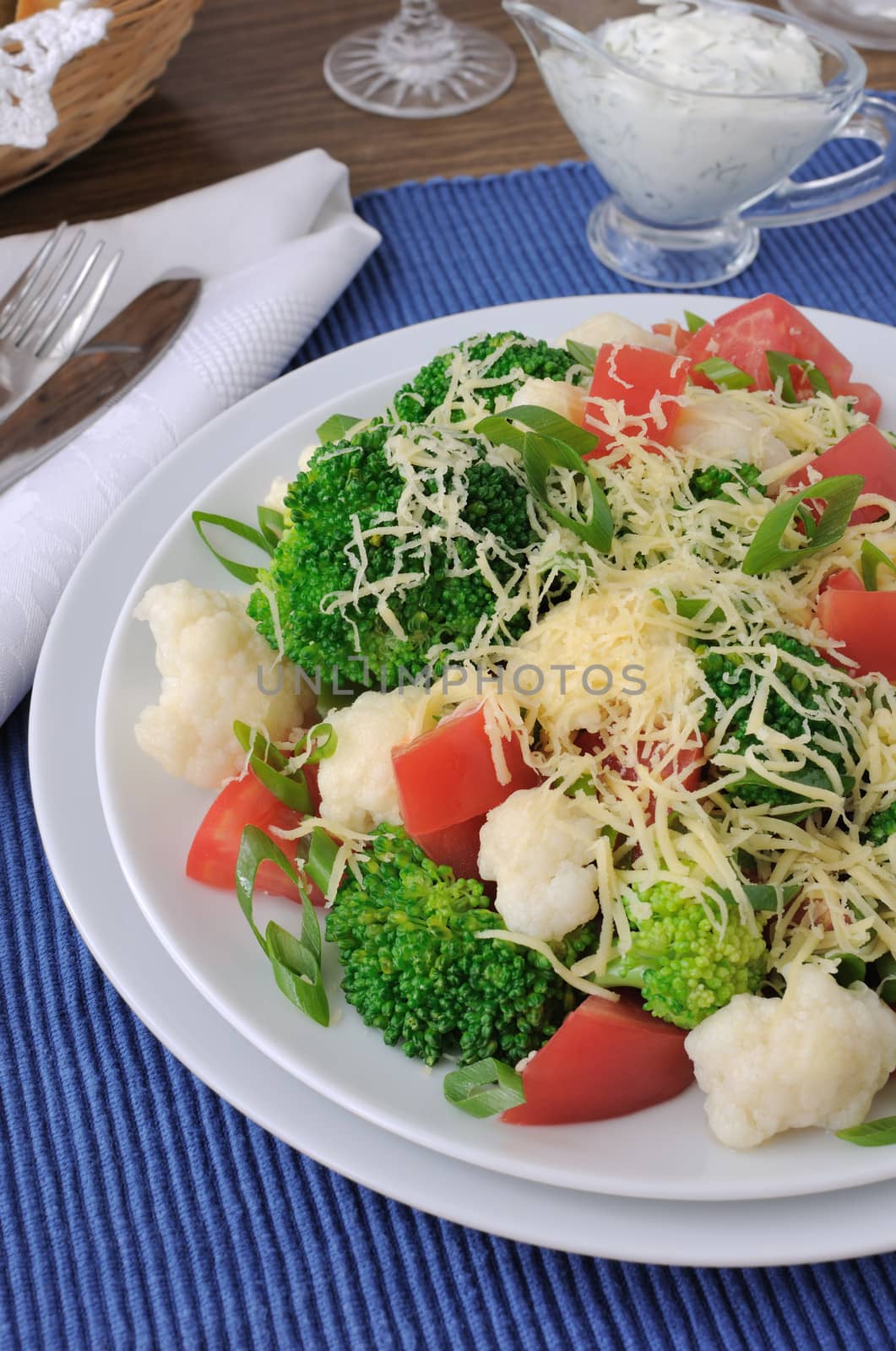 Salad of cauliflower and broccoli, tomatoes and cheese