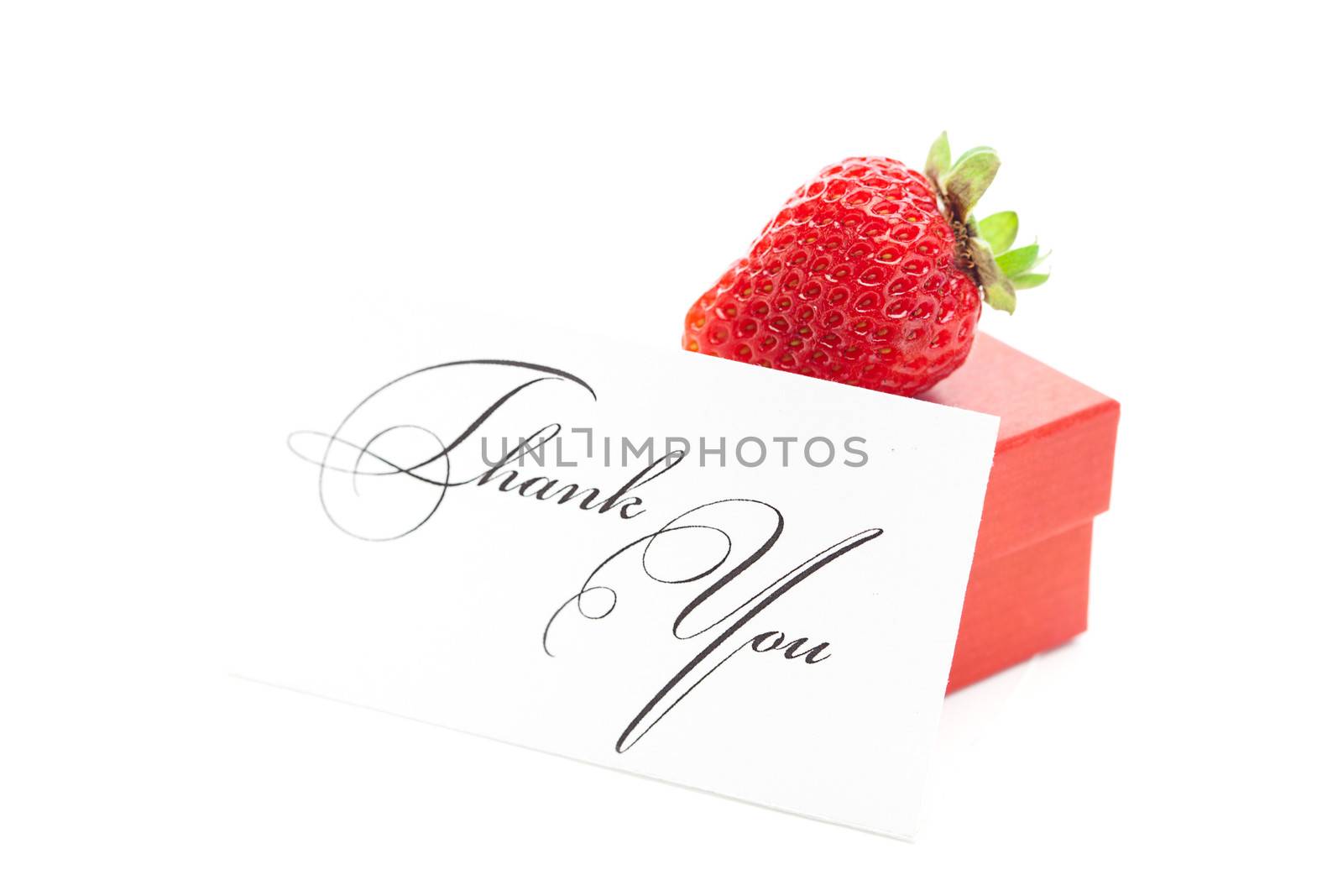 red gift box, thank you card and strawberries isolated on white by jannyjus