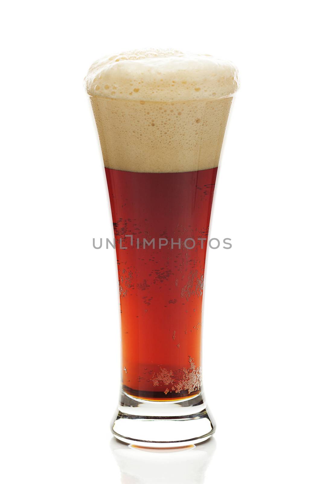 dark beer with the foam in a tall glass isolated on white by jannyjus