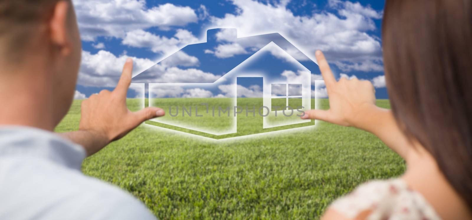 Couple Framing Hands Around House Figure in Grass Field by Feverpitched