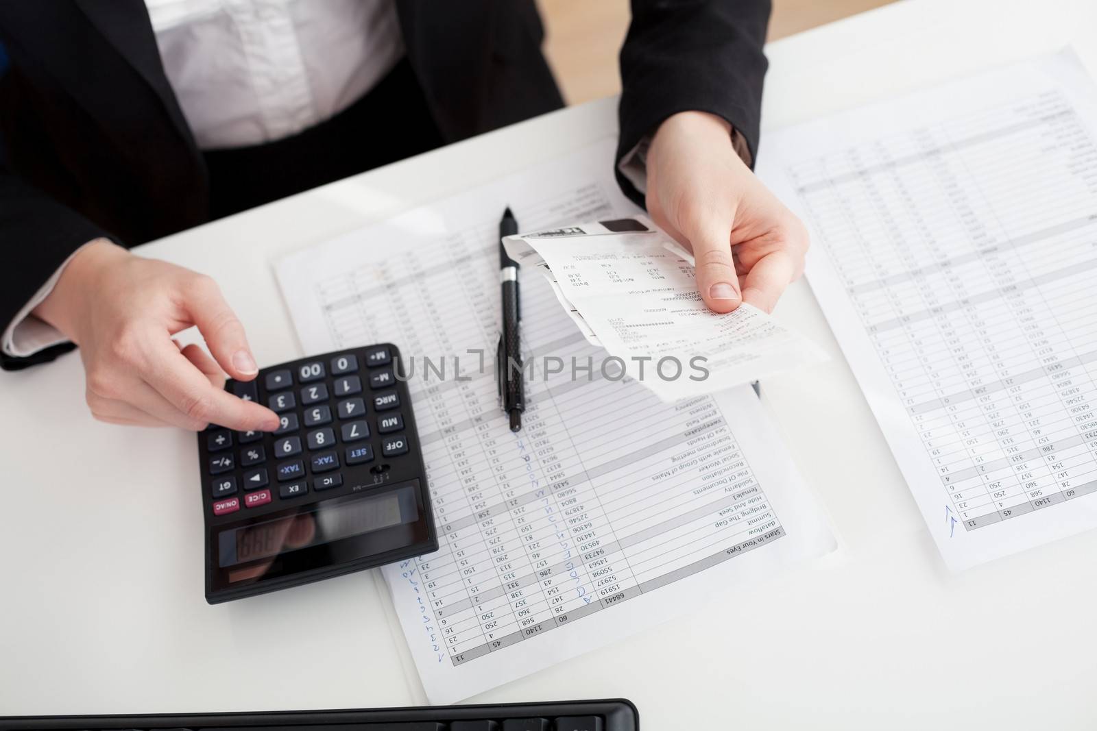 Cheerful accountant businesswoman working in the office