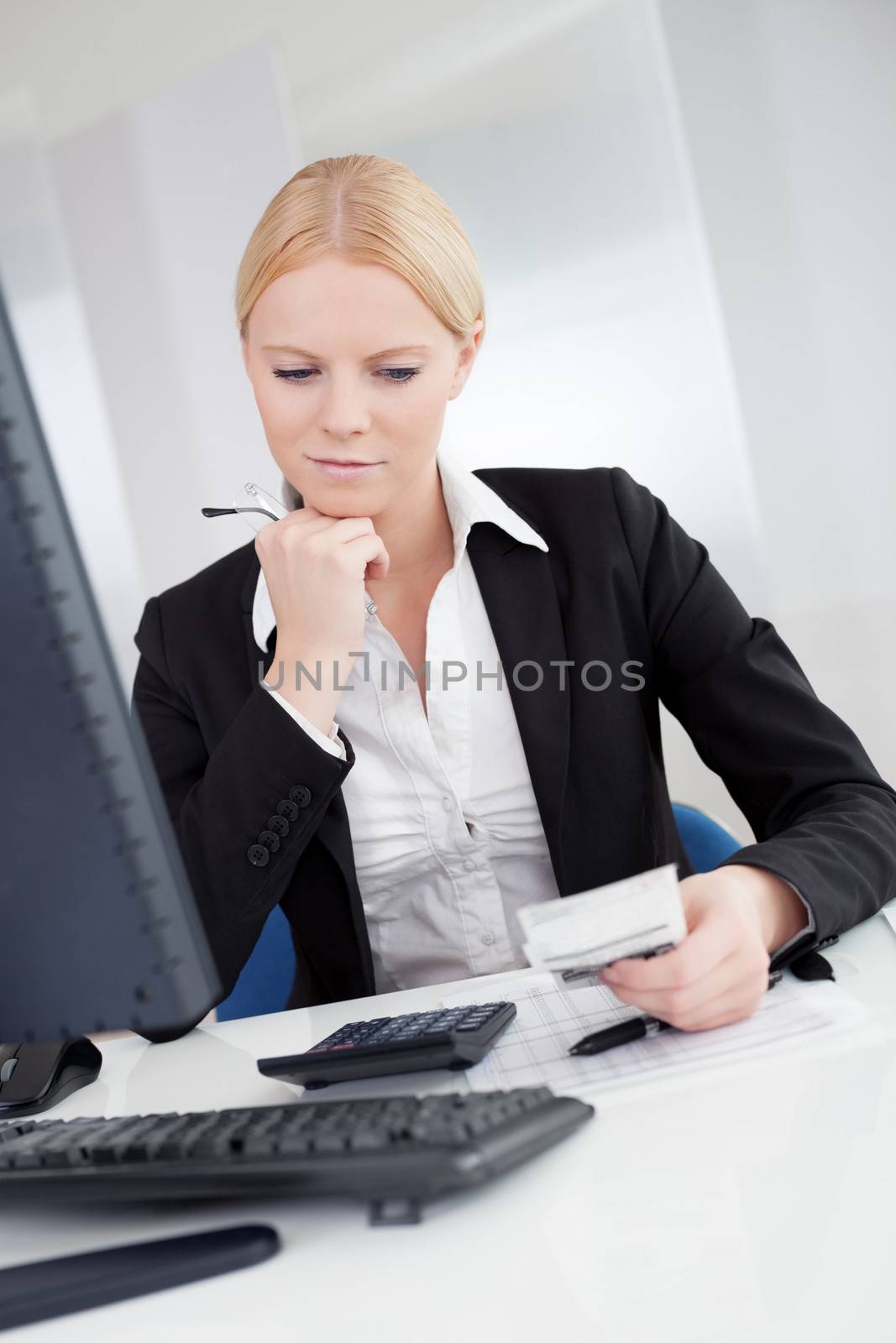 Cheerful accountant businesswoman working in the office