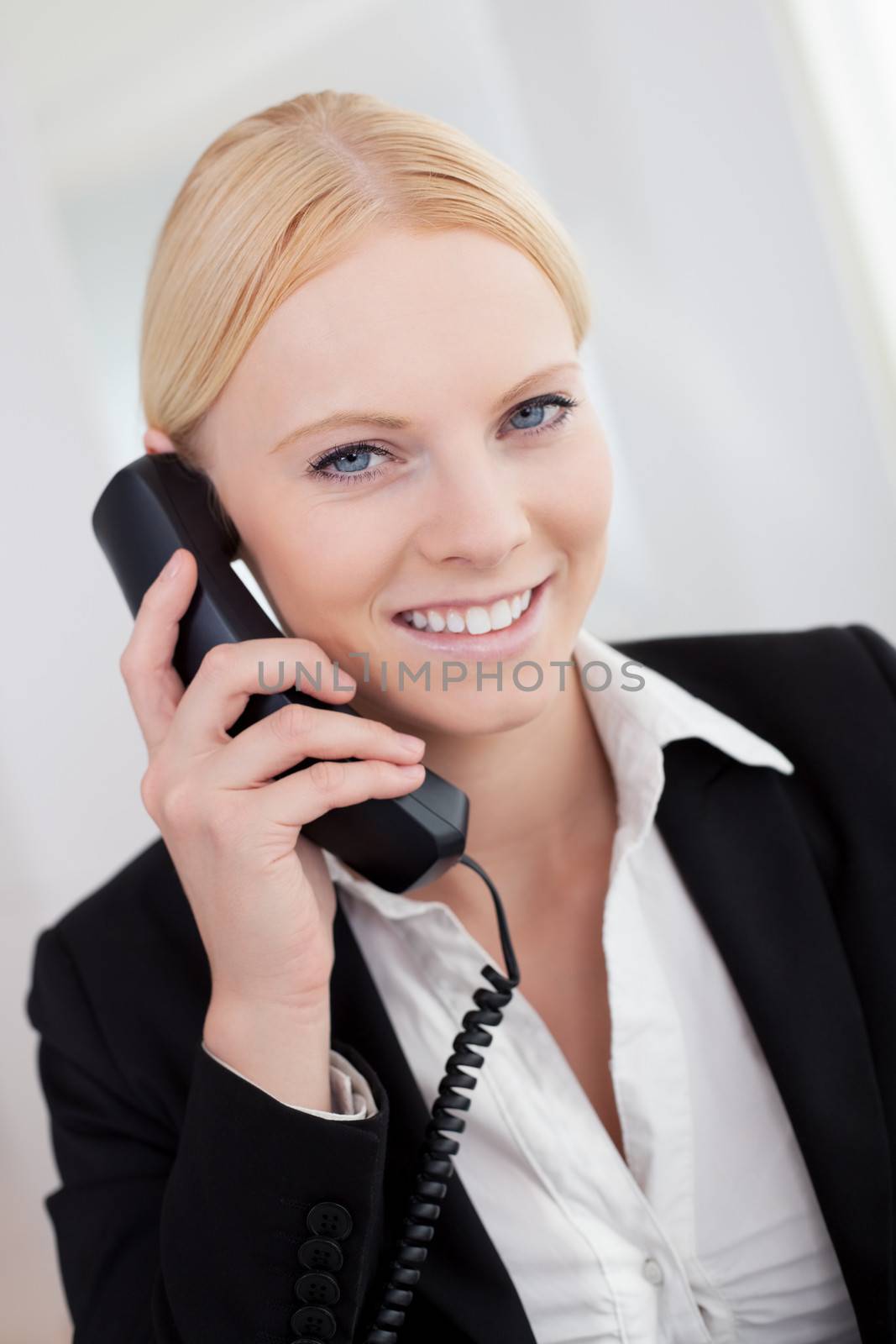 Beautiful businesswomen talking on the phone in the office