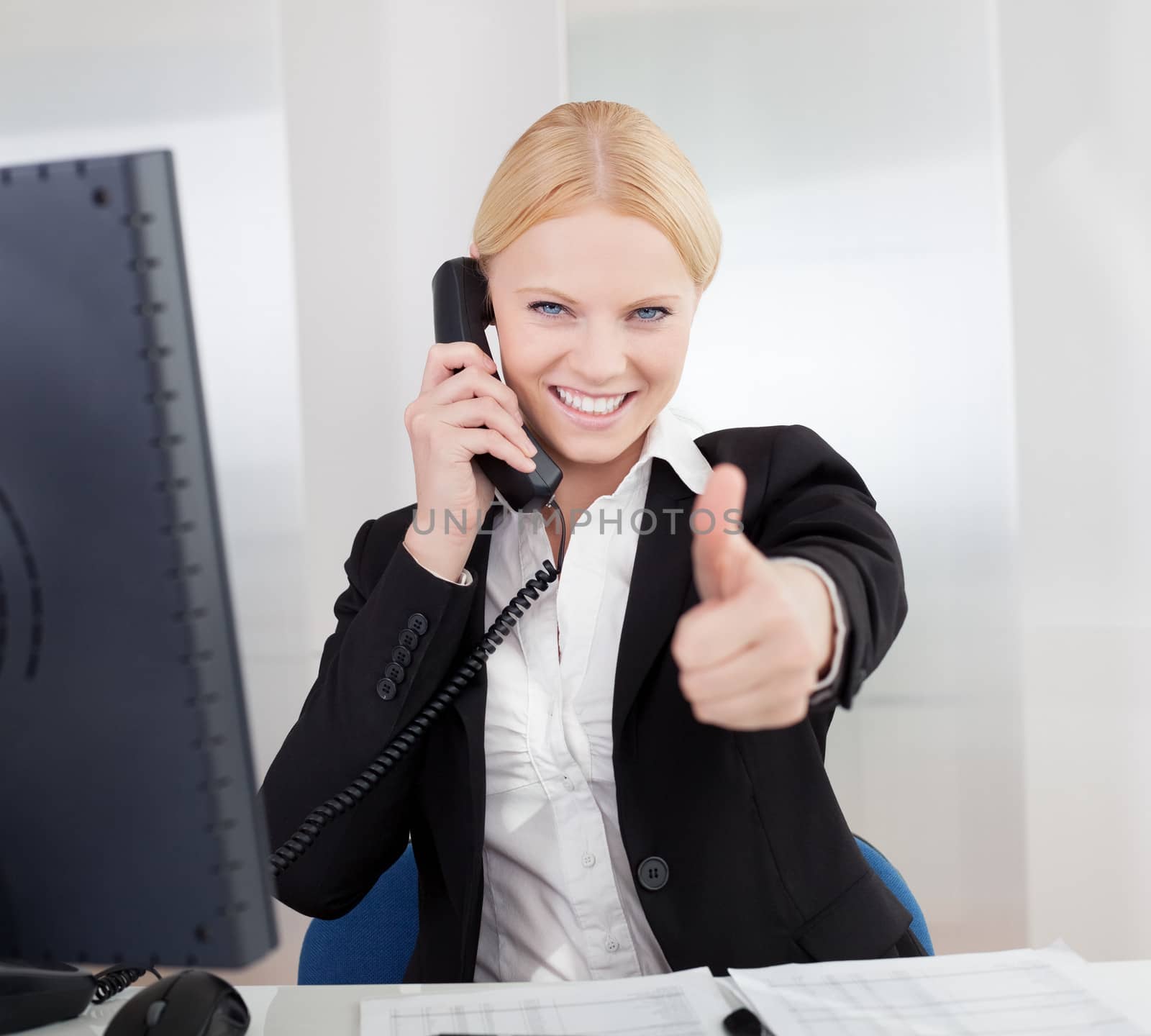 Beautiful businesswomen talking on the phone by AndreyPopov