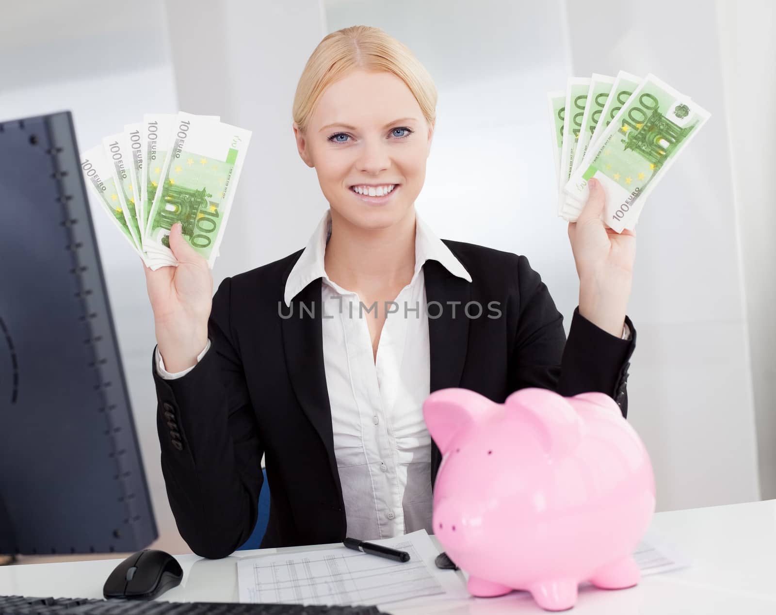 Businesswoman holding euro currency notes in the office