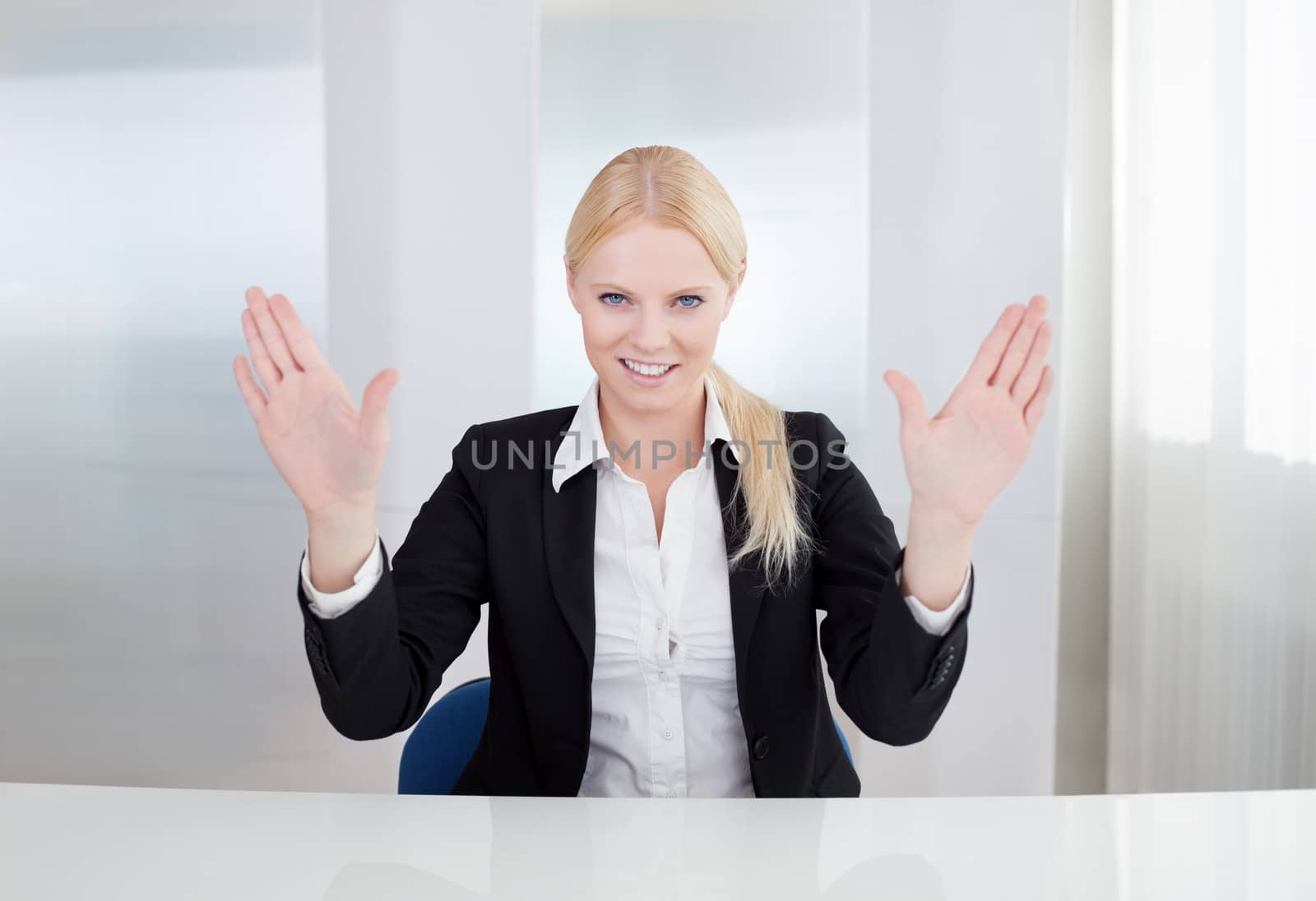 Beautiful businesswoman touching the screen with her finger