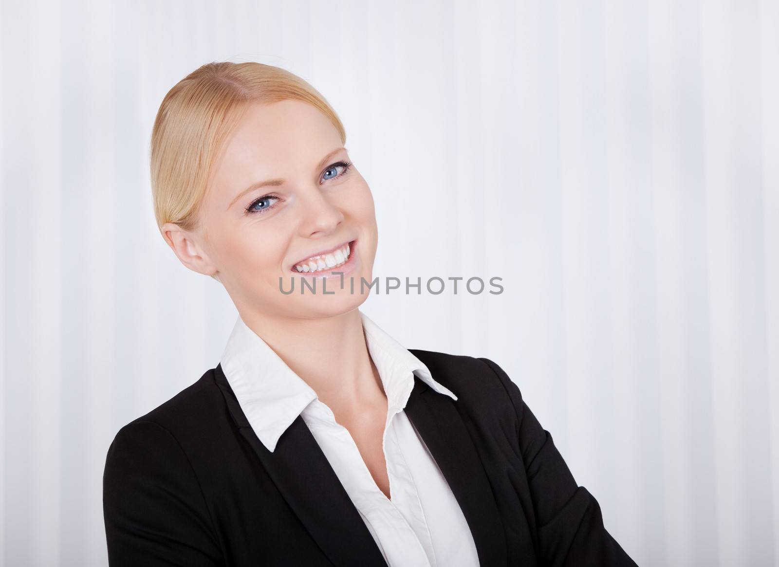 Portrait of beautiful young businesswoman by AndreyPopov