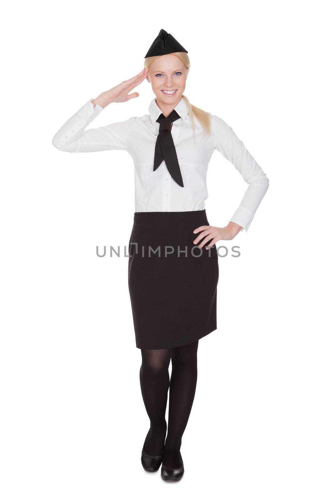 Portrait of beautiful young stewardess. Isolated on white