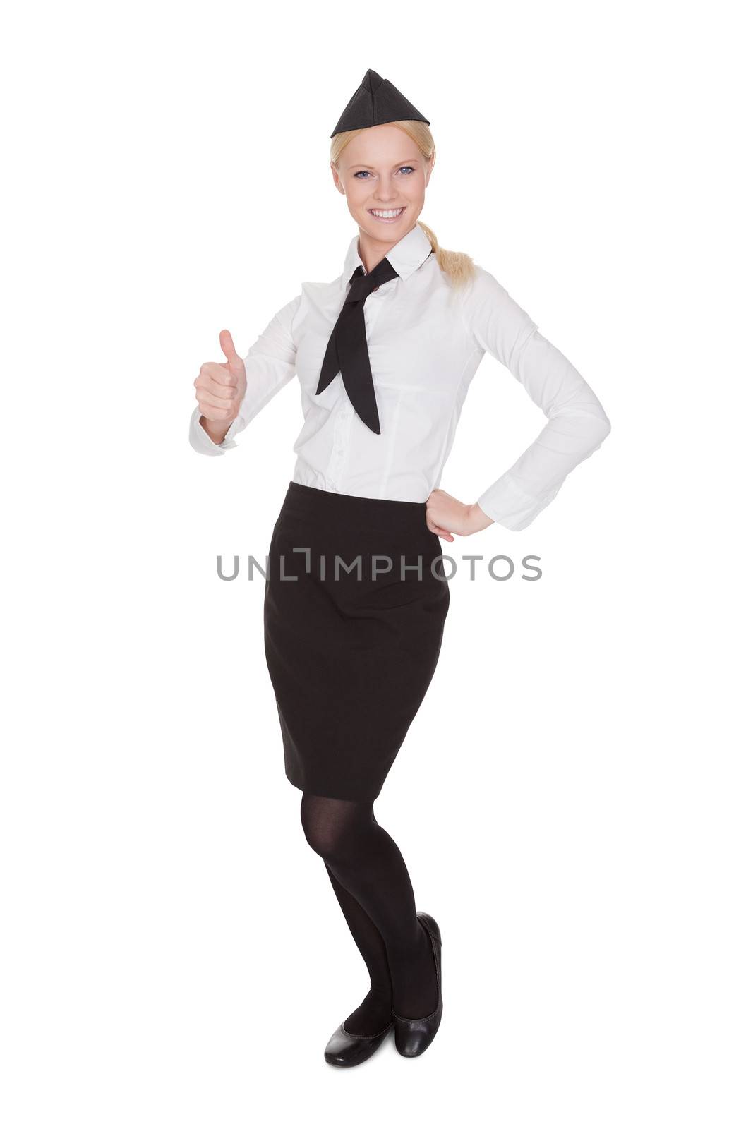 Portrait of beautiful young stewardess. Isolated on white