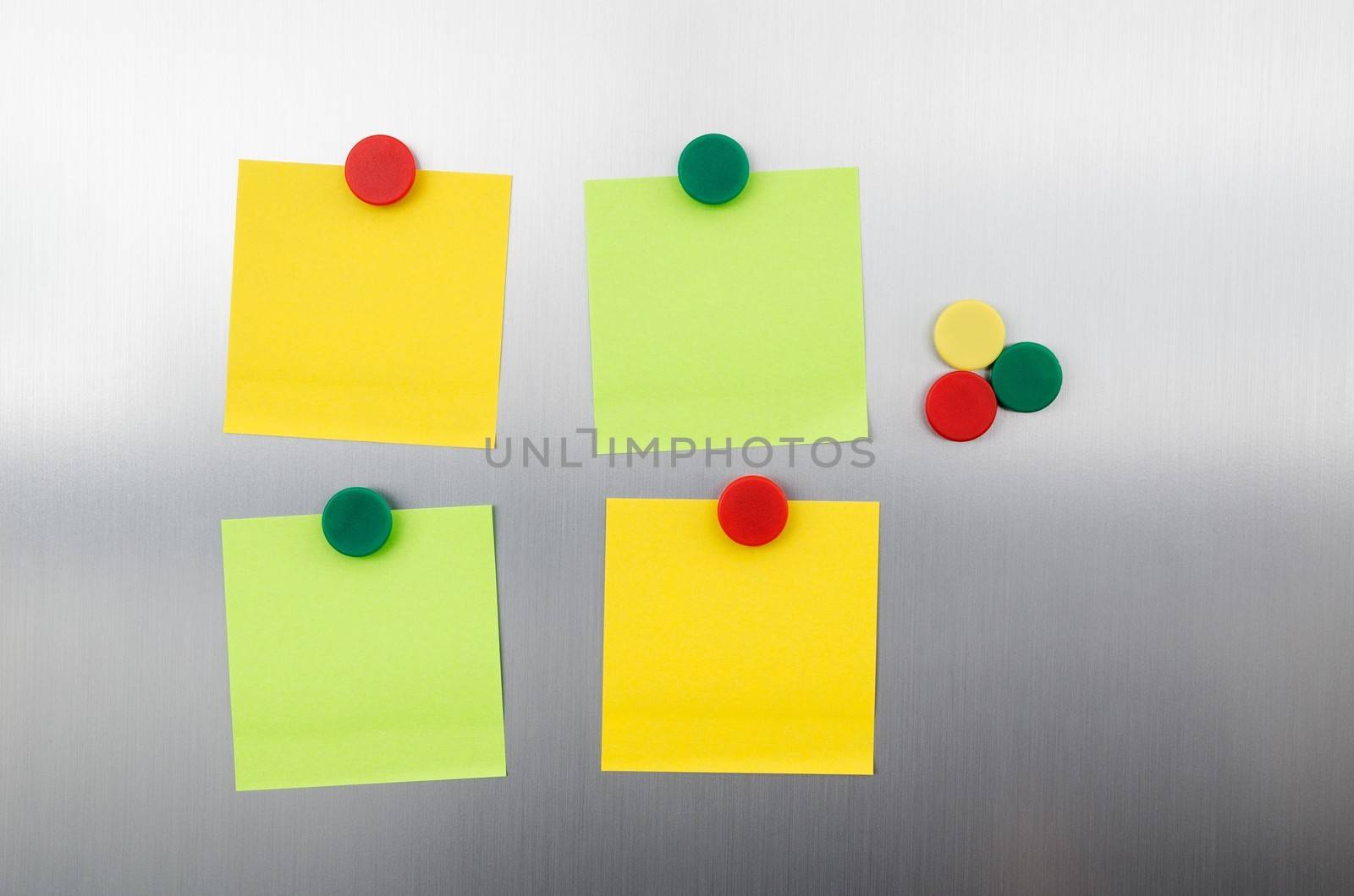 Coloured notes and magnets on inox metallic fridge by simpson33