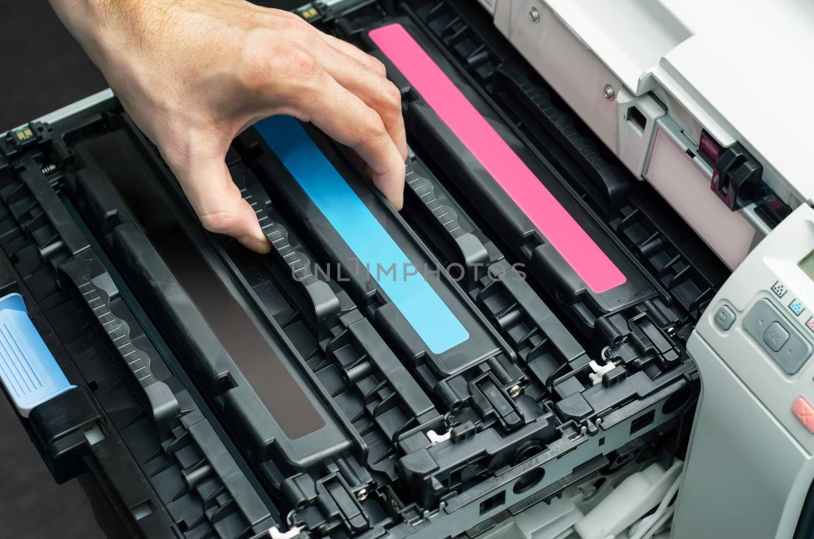 Man puts toner in the printer