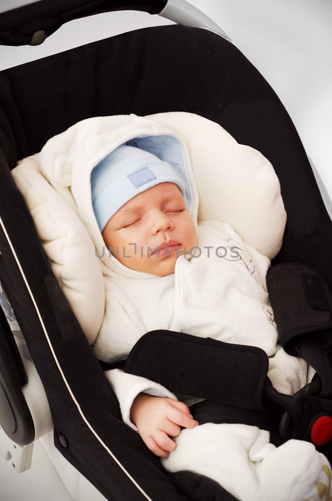 Little baby boy sleeping in car seat by simpson33