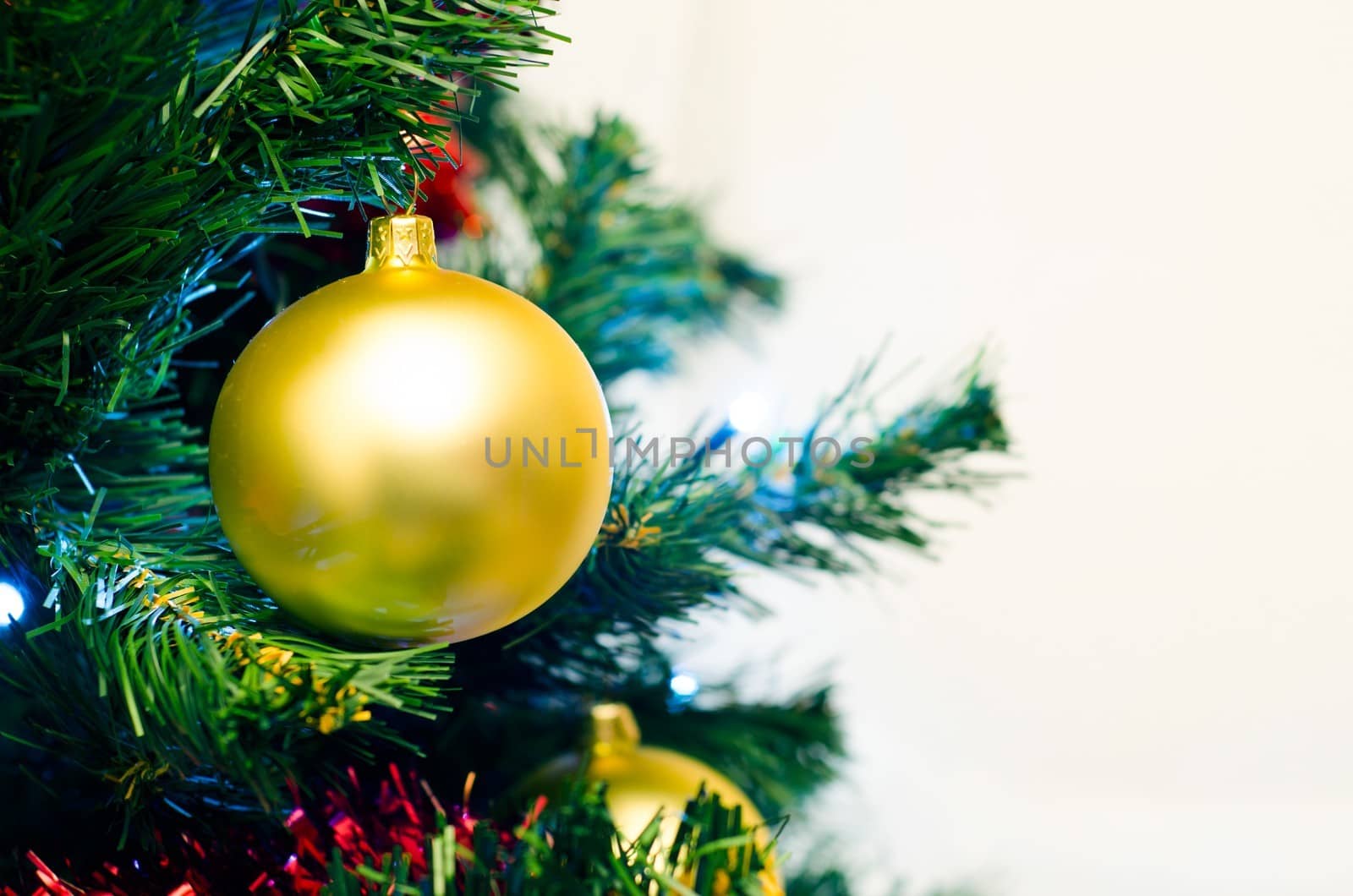 Closeup of christmas decoration. Golden bauble on xmas tree by simpson33