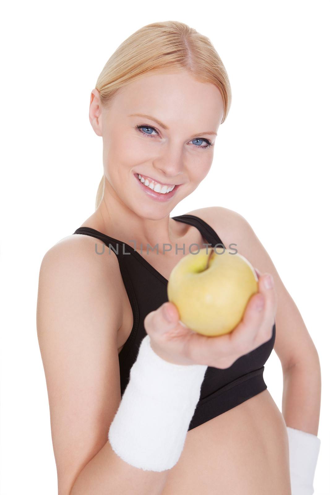 Beautiful young fitness woman with apple by AndreyPopov
