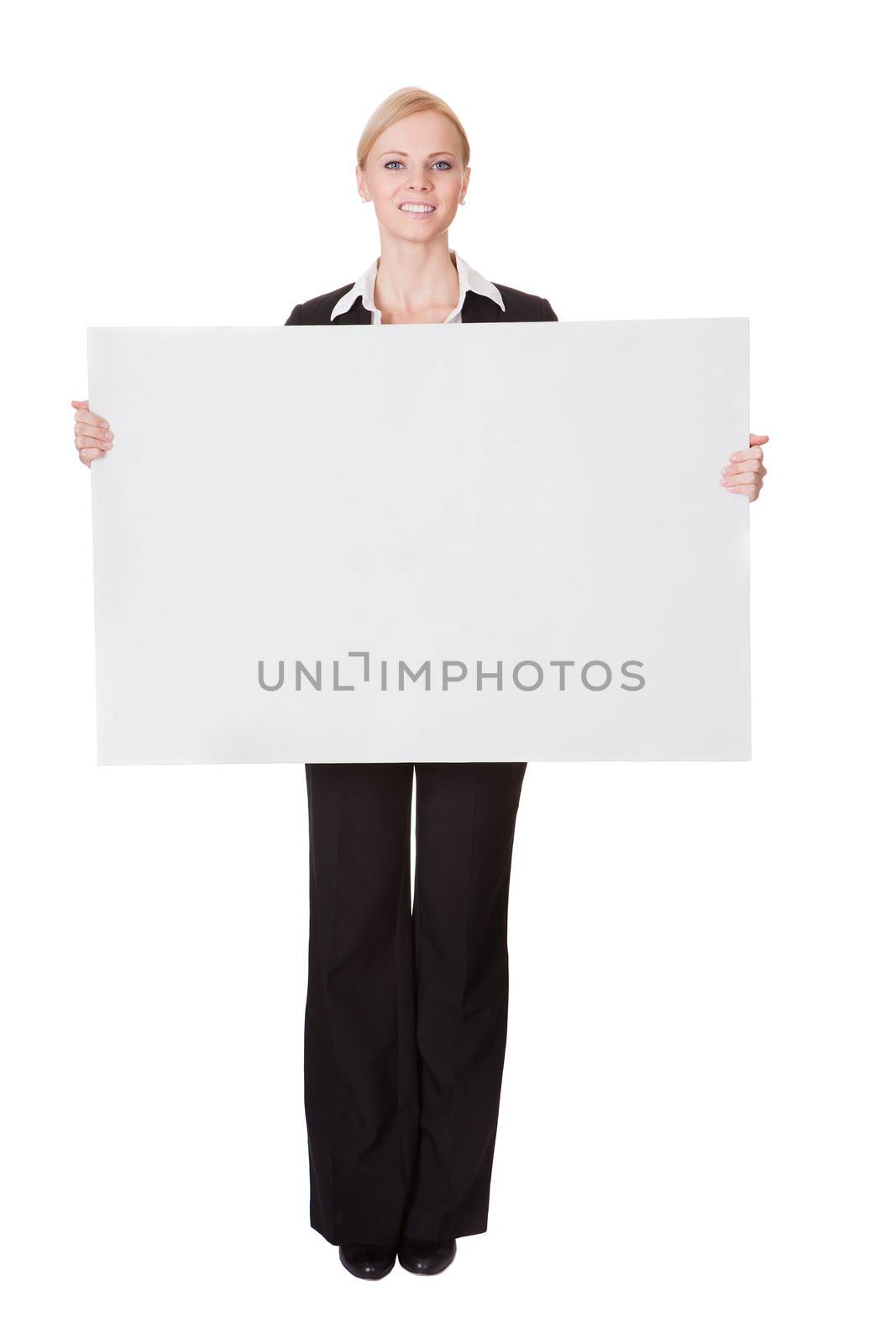 Businesswoman presenting empty banner by AndreyPopov