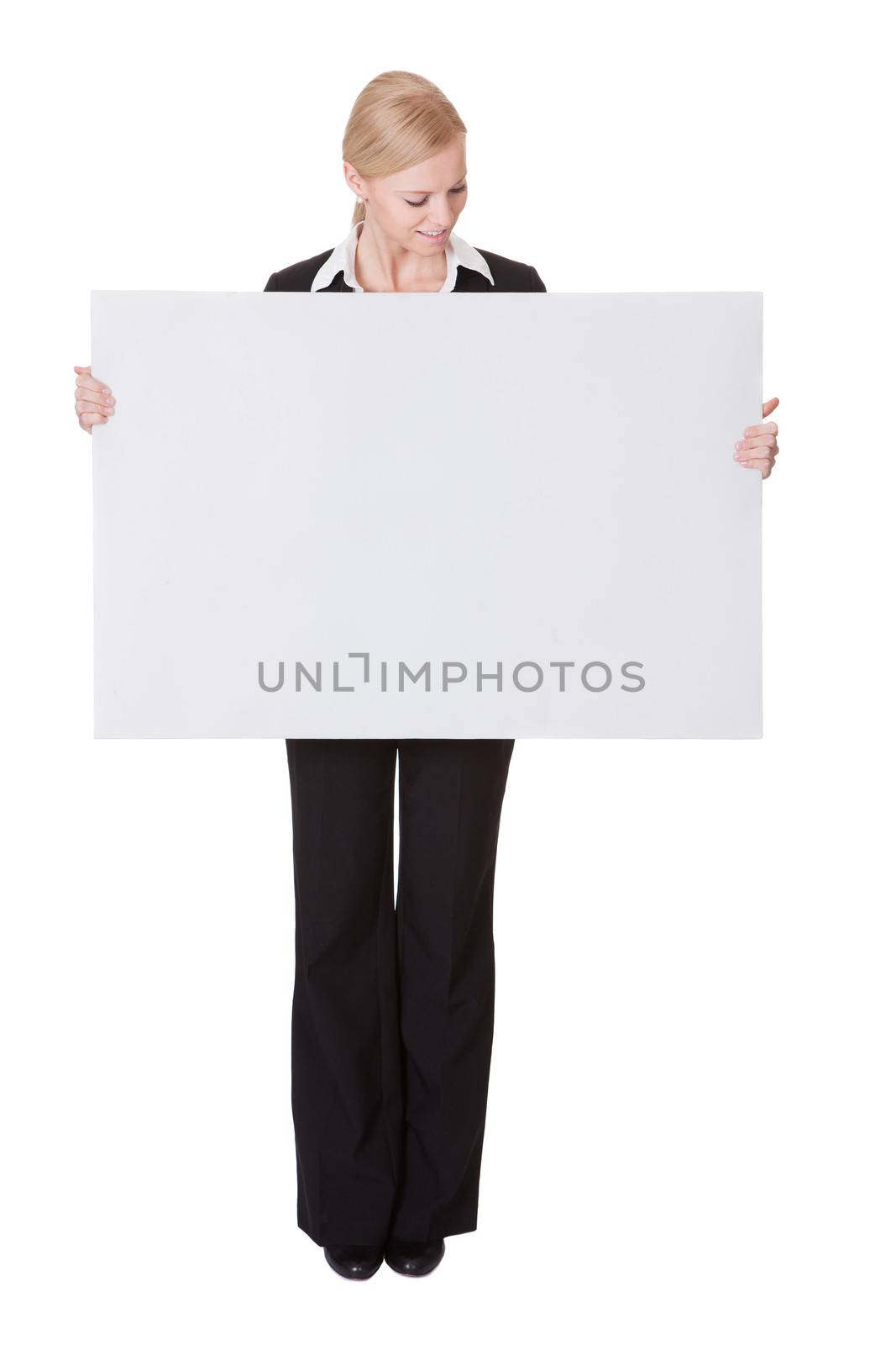 Businesswoman presenting empty banner by AndreyPopov