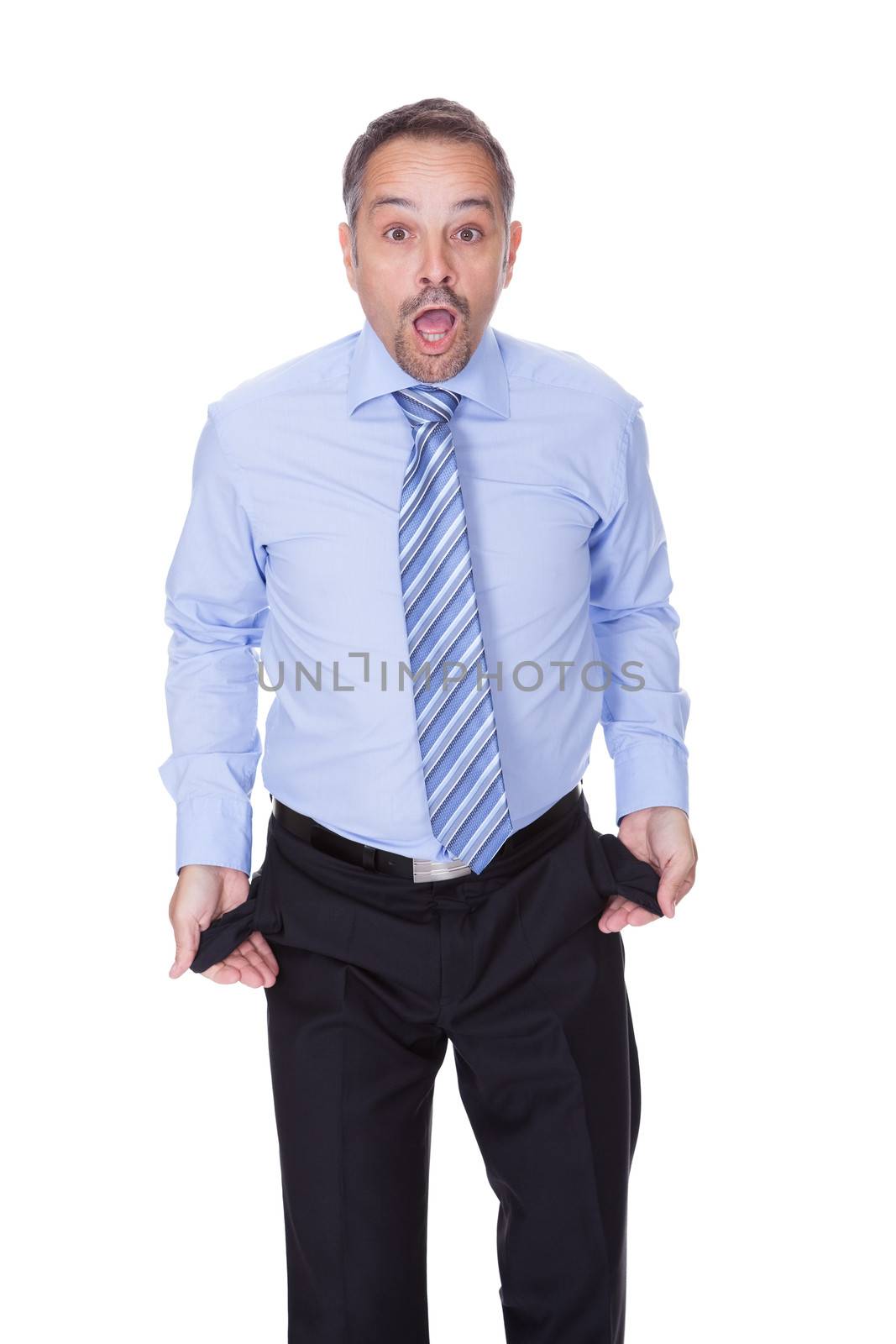 Businessman Showing Empty Pockets On White Backgrounds