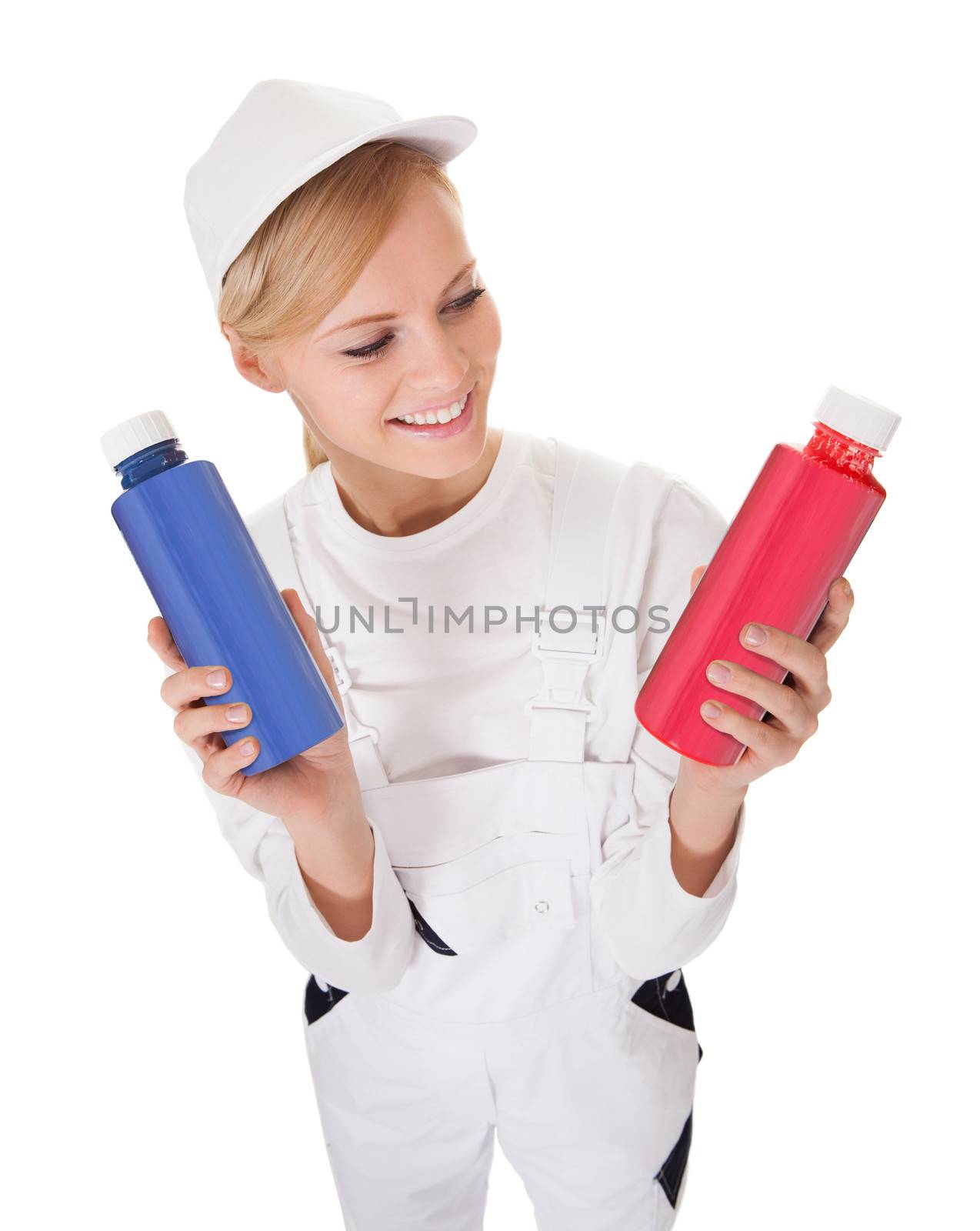 Professional young painter woman holding two buckets of paint. Isolated on white