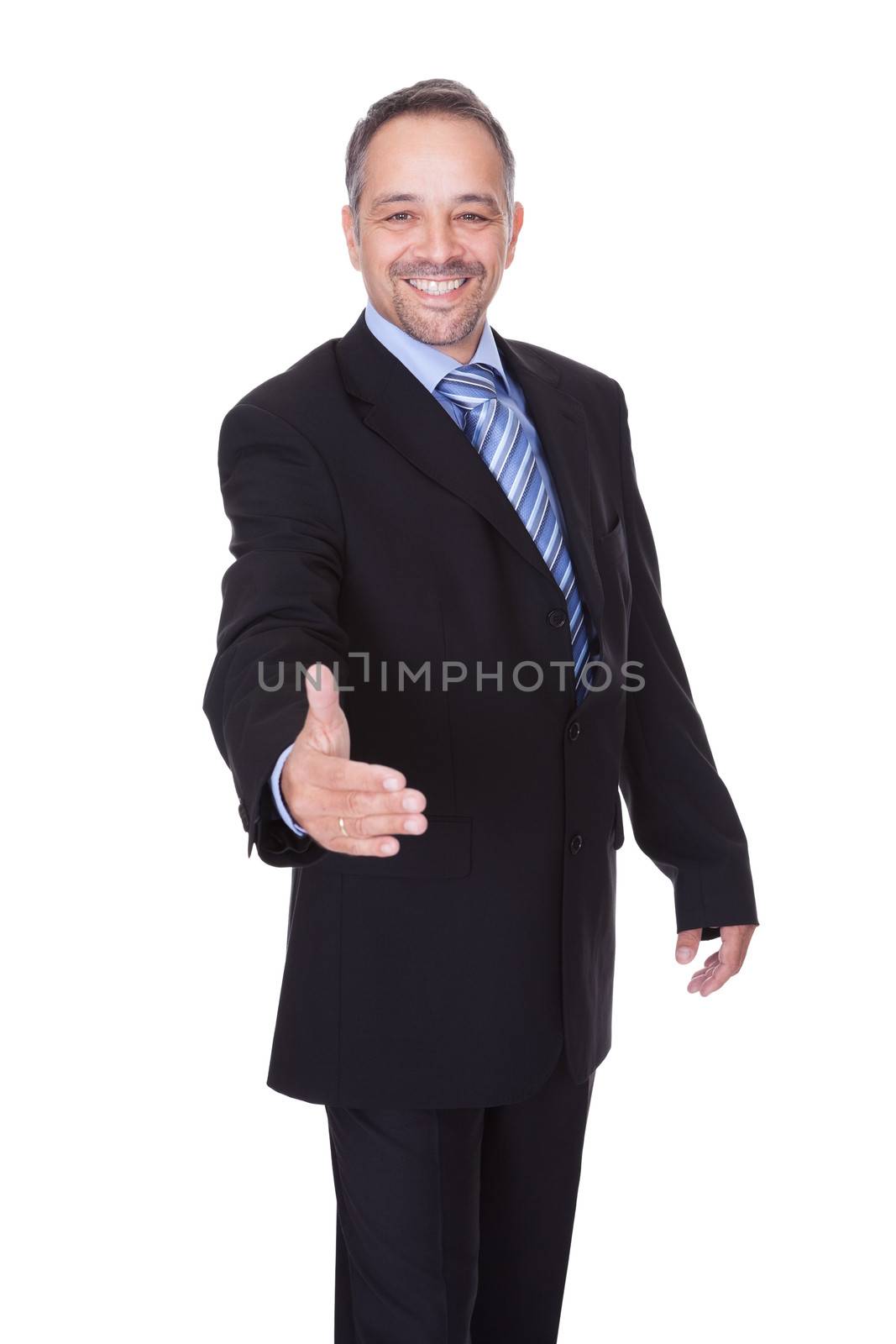 Portrait Of A Businessman Offering Handshake On White Background