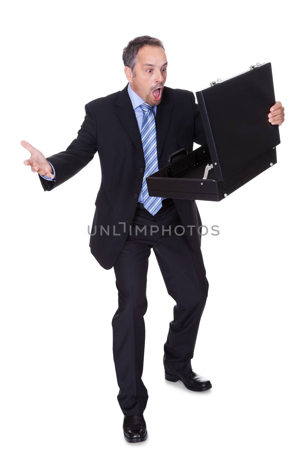 Portrait Of Businessman Shocked By Losing Money From Briefcase