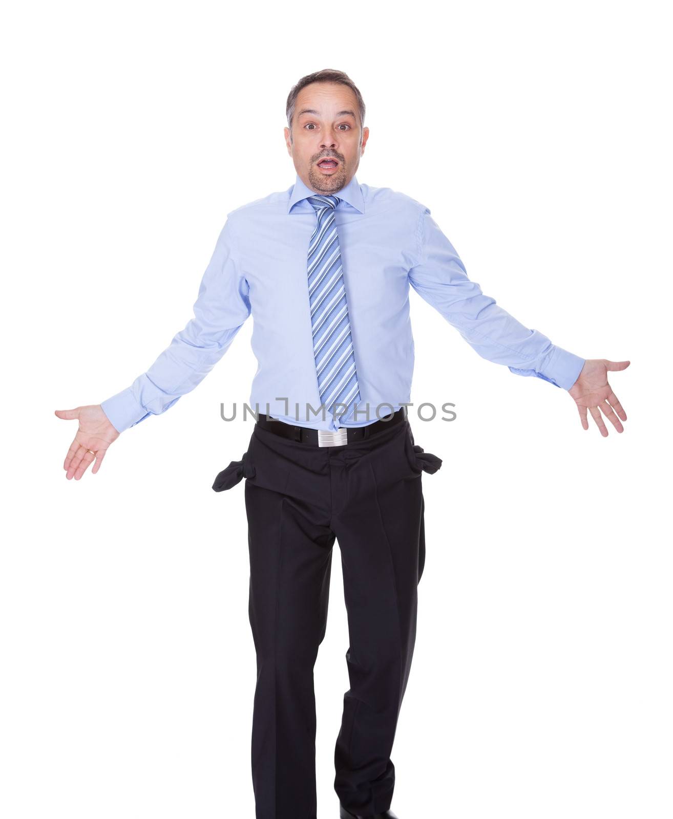 Businessman Showing Empty Pockets On White Backgrounds
